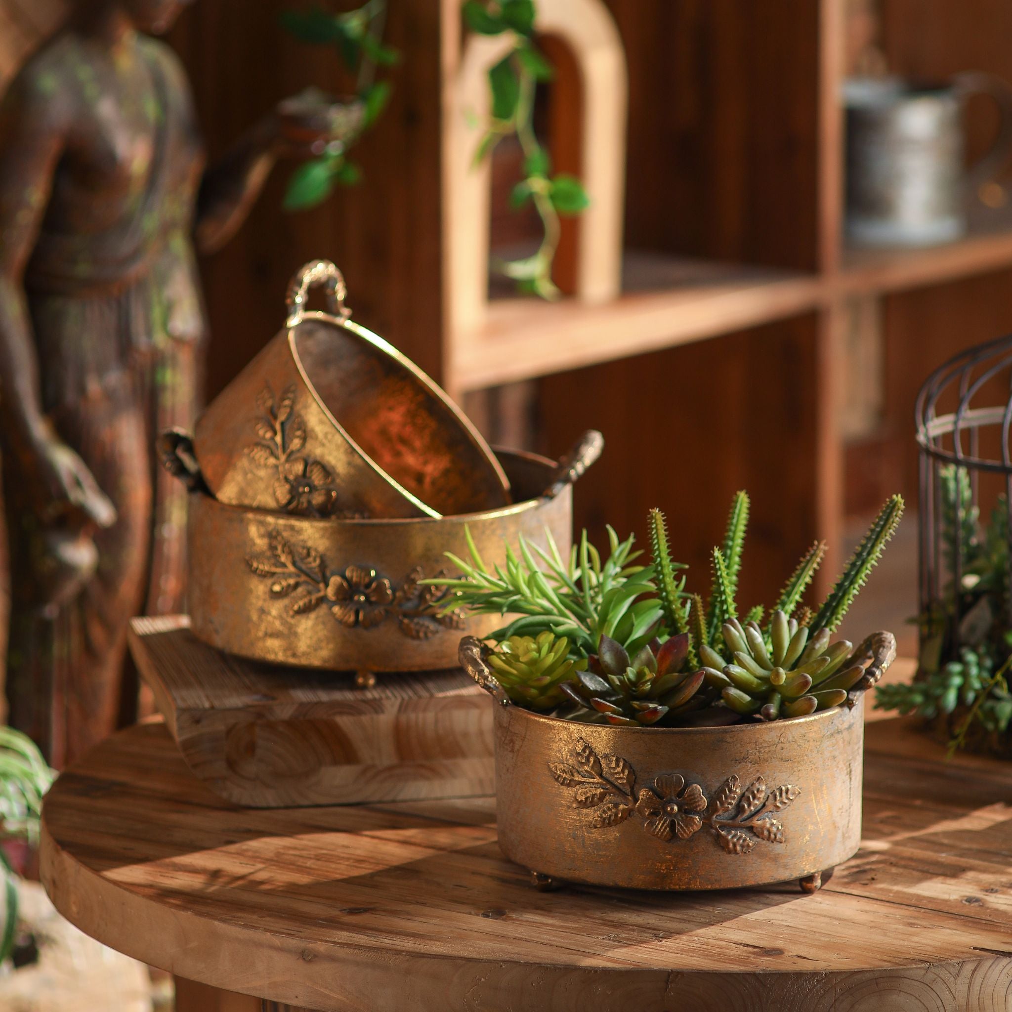 Ottavia footed planter set of three in antique gold with floral garland bands