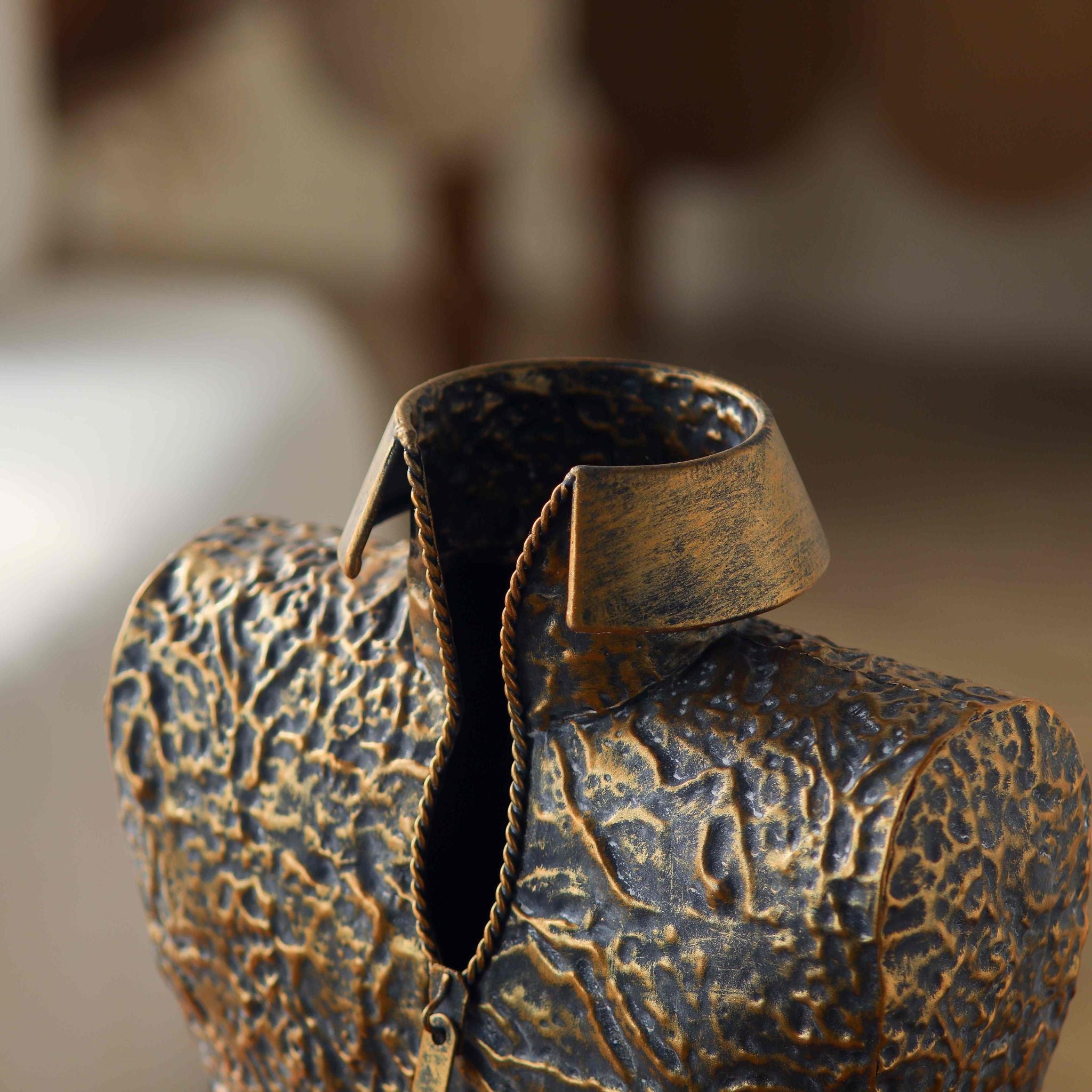 Close view of the standing collar and rope zip with tab on the Aldo vase