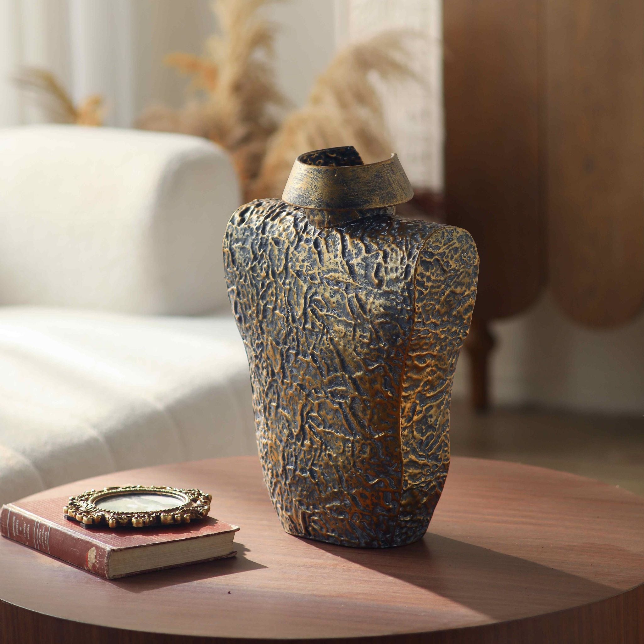 Detail of the crushed cloth texture and brushed gold finish on the Aldo torso vase