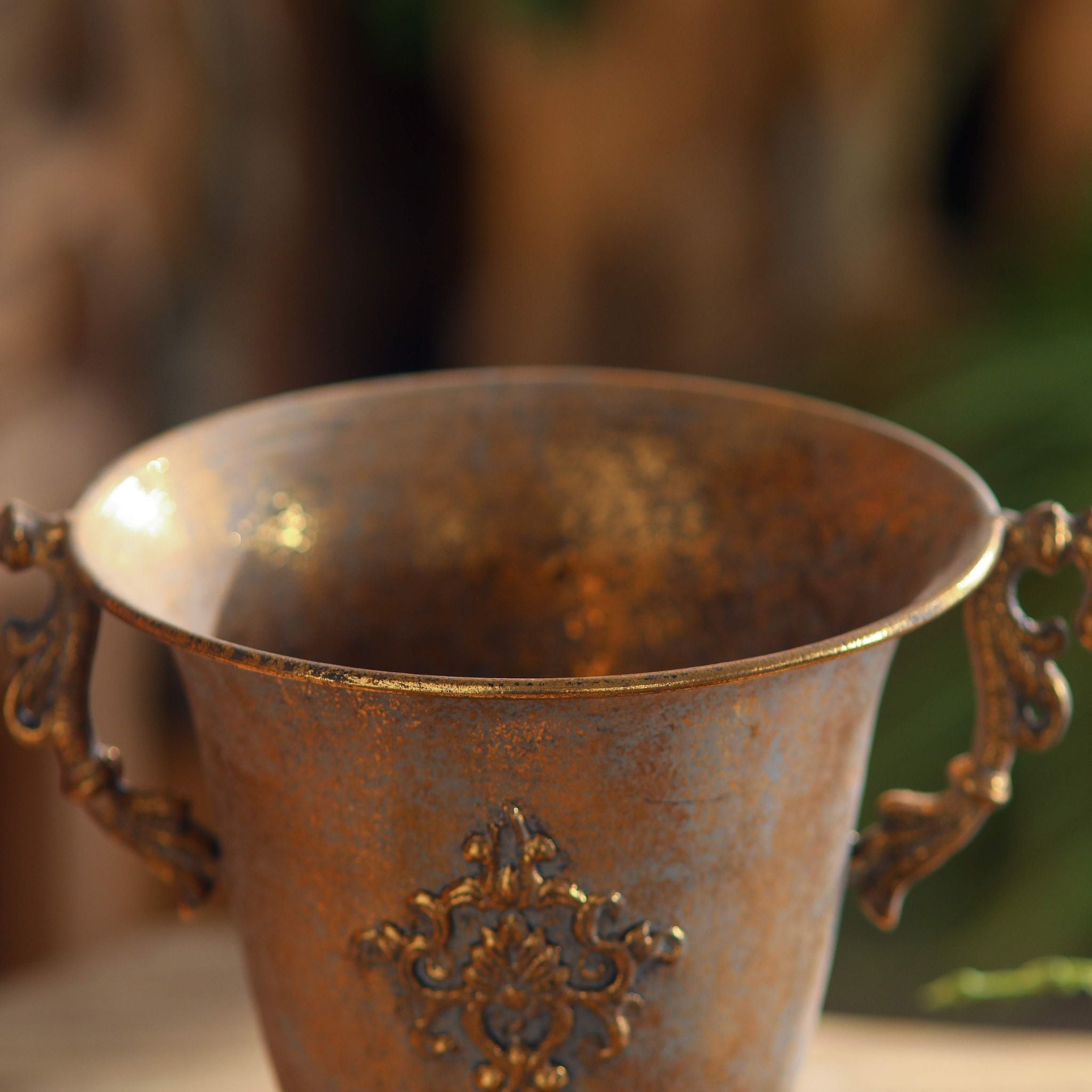 Looking over the flared rim of the Bruno urn showing the mottled patina inside