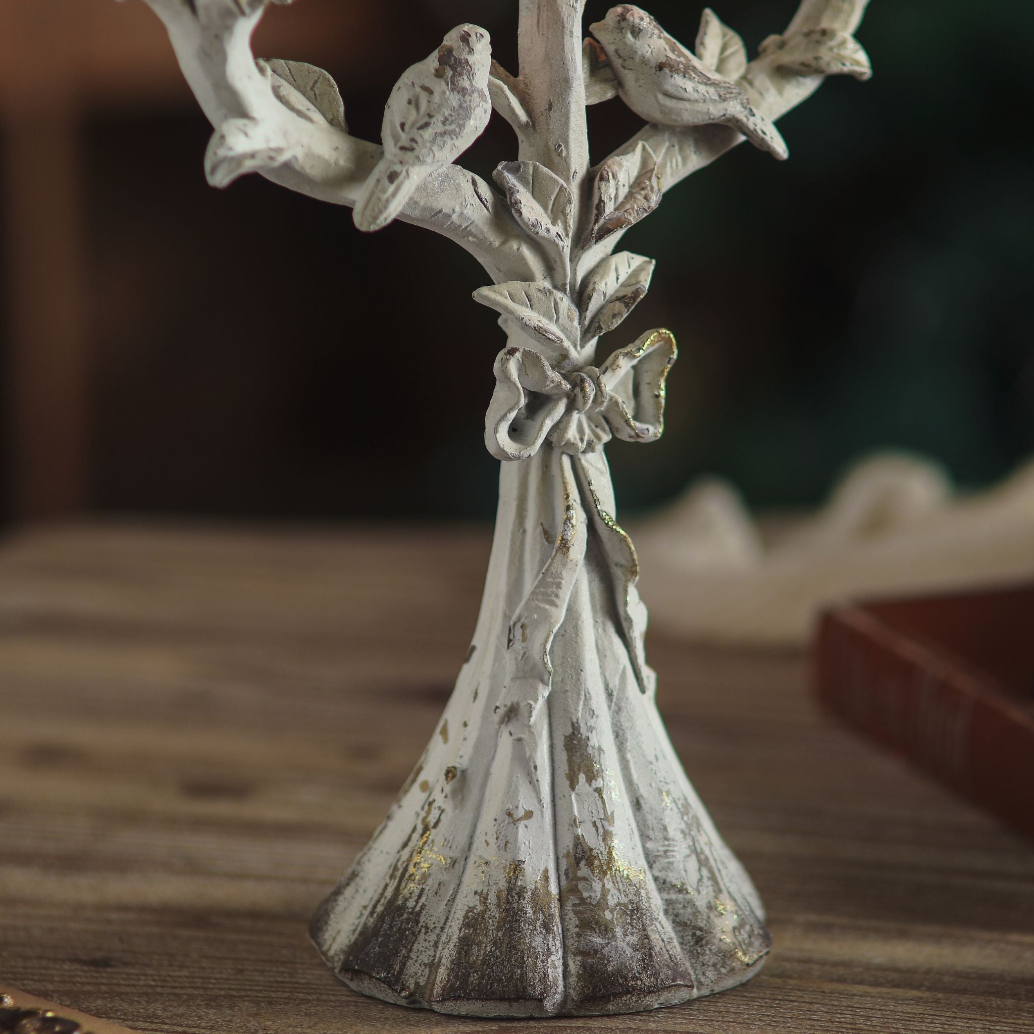 Close view of the two birds and tied bow on the stem of the Corfu candelabra