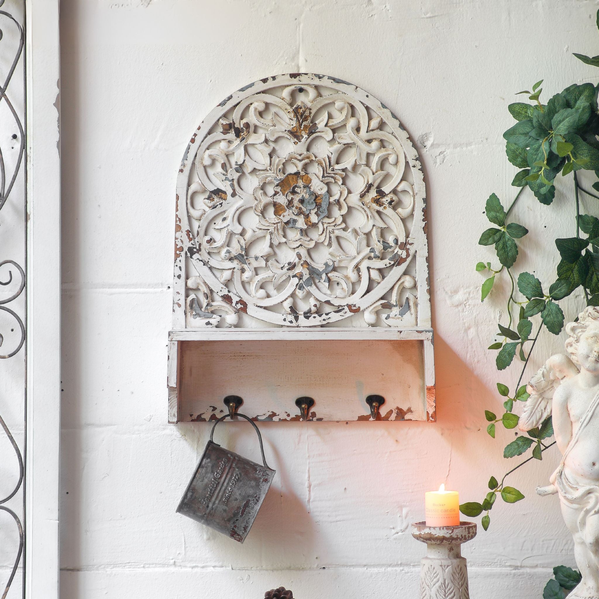 Dimitri French provincial wall shelf, arched pierced panel in distressed white with shelf and three hooks, front view