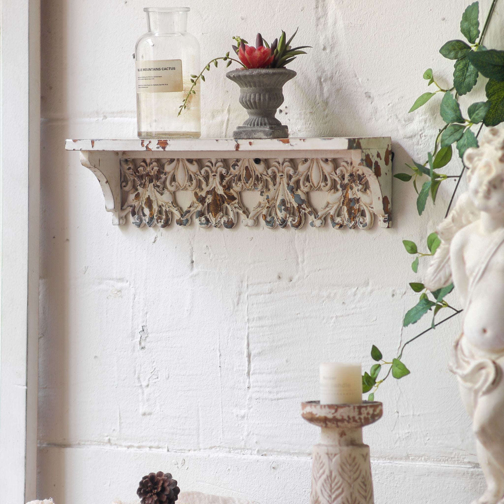 Elias wall shelf ledge edge showing chipped white finish over warm timber