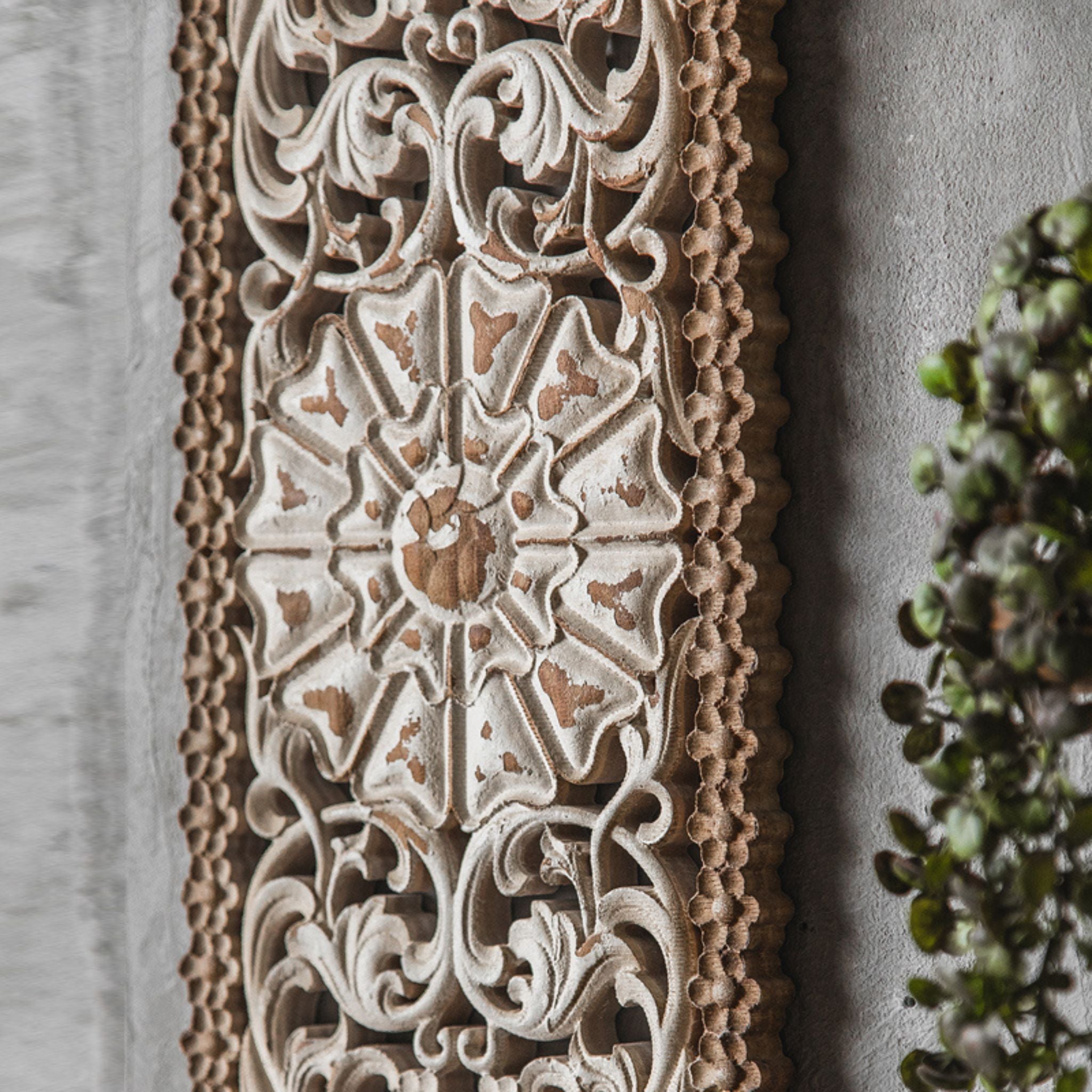 Calla carved wall panel styled on a wall with wall decor