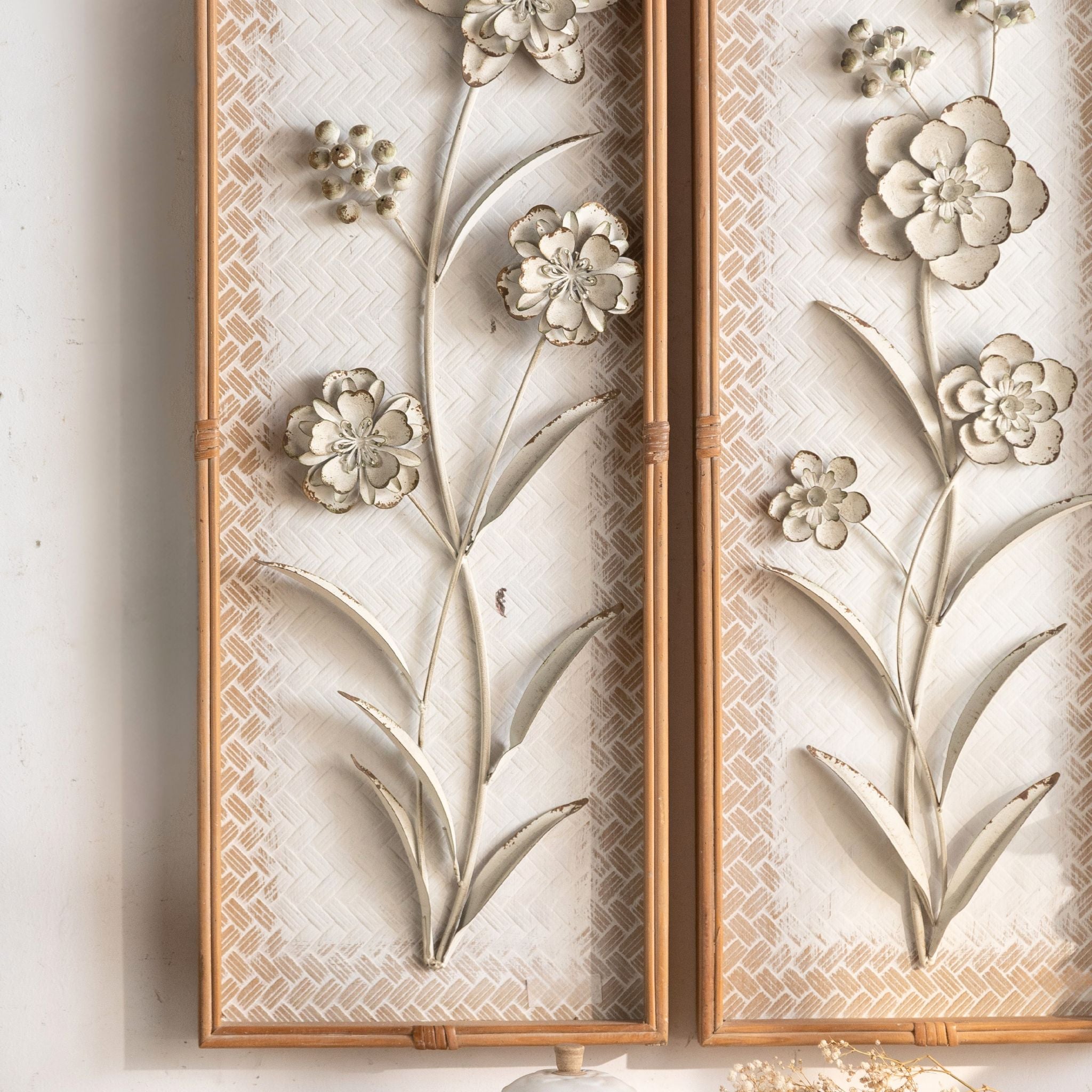 Both Aurélien panels side by side, showing the two floral designs in distressed metal.
