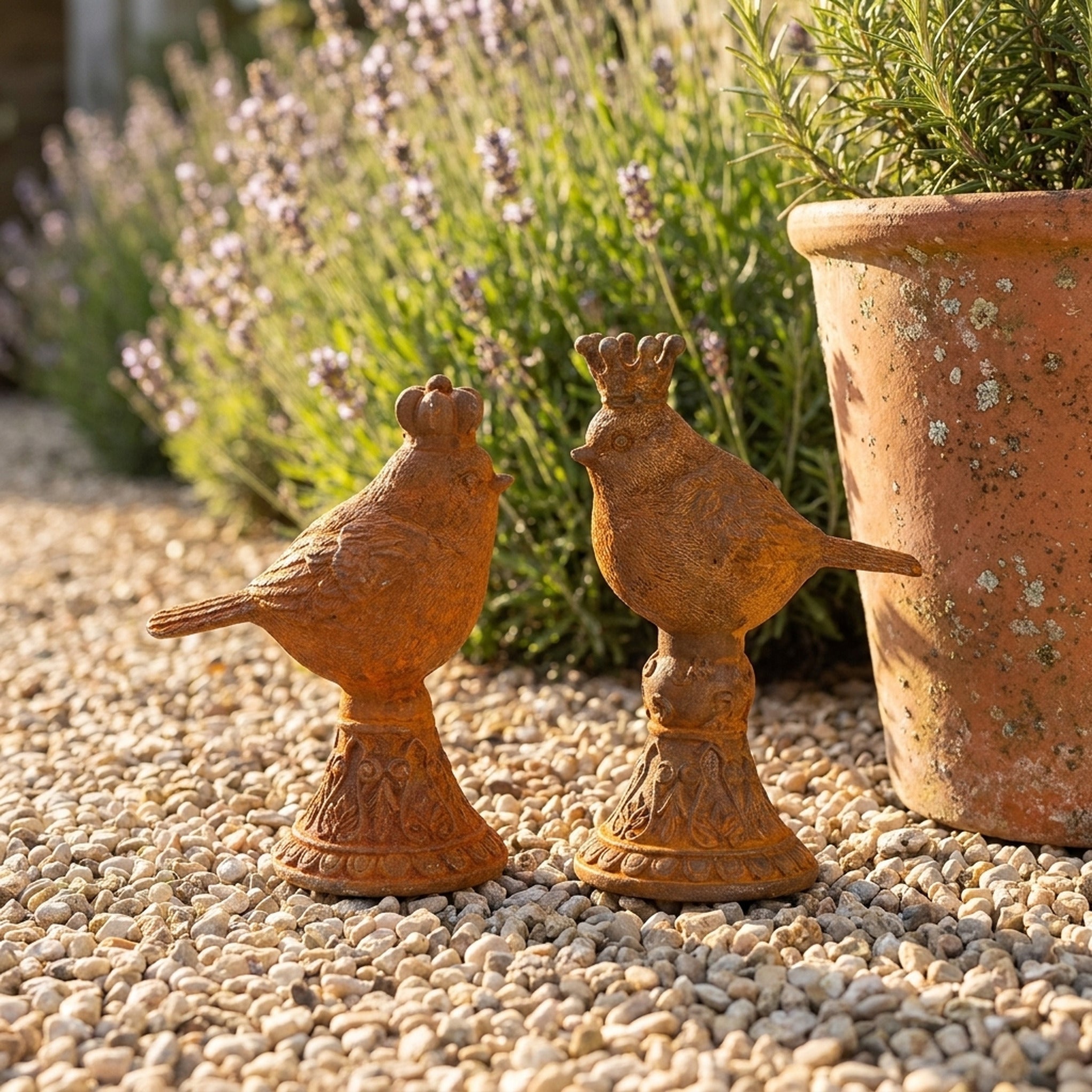 Tom Tit and Jenny Wren cast iron birds side view showing both crowns and pedestals