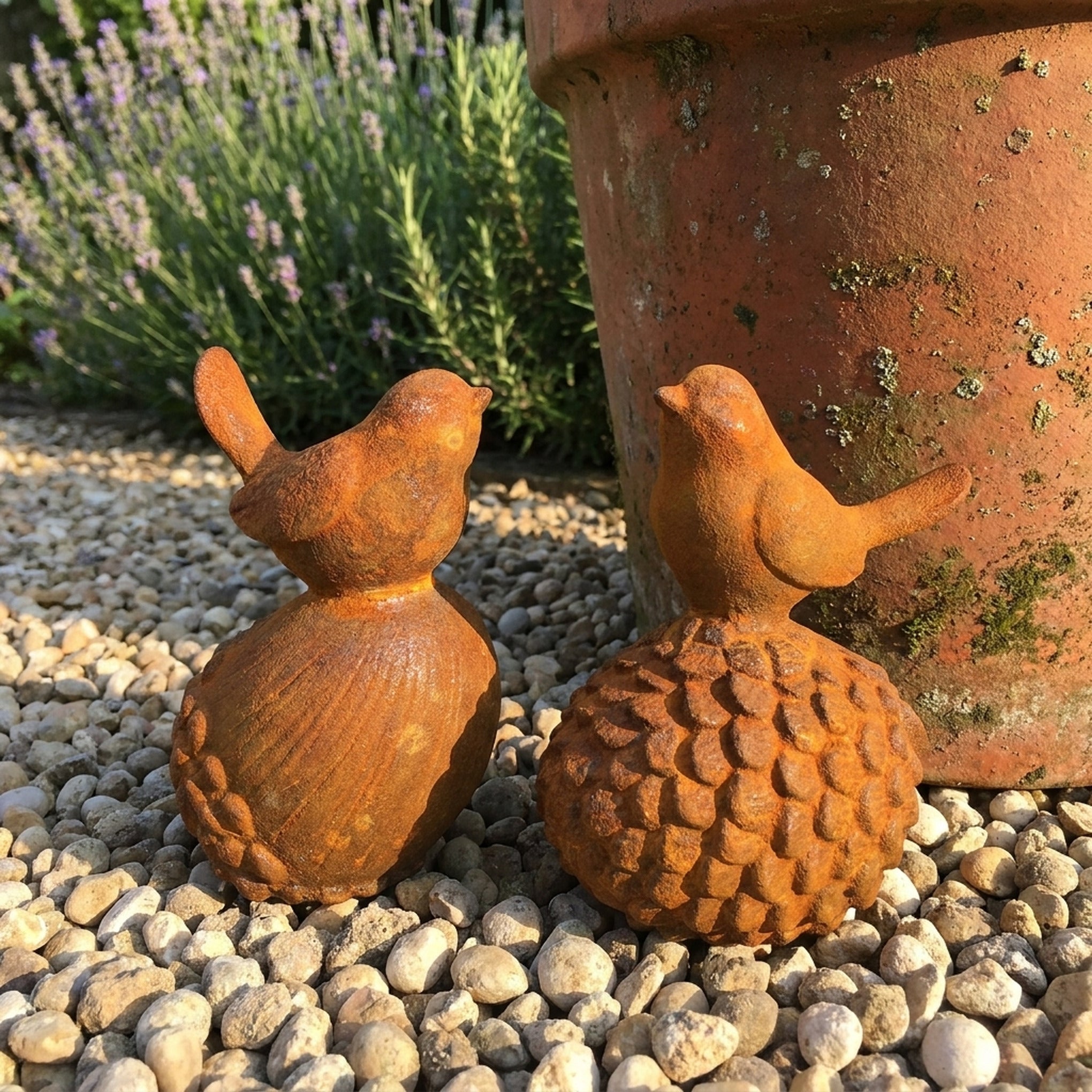 Robin and Sparrow cast iron birds side view showing the ribbed acorn and the scaled pinecone bases
