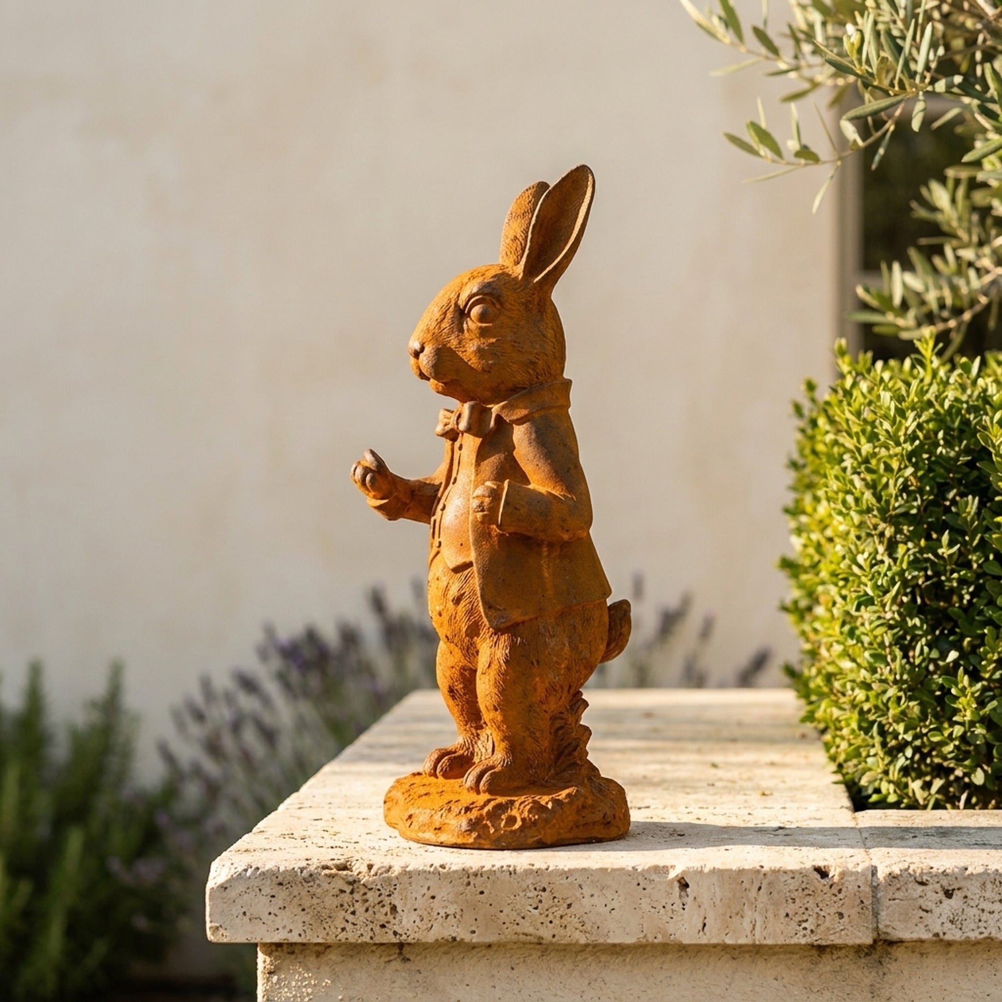 Doctor Bramble rabbit statue side profile showing the coat tails and oval base