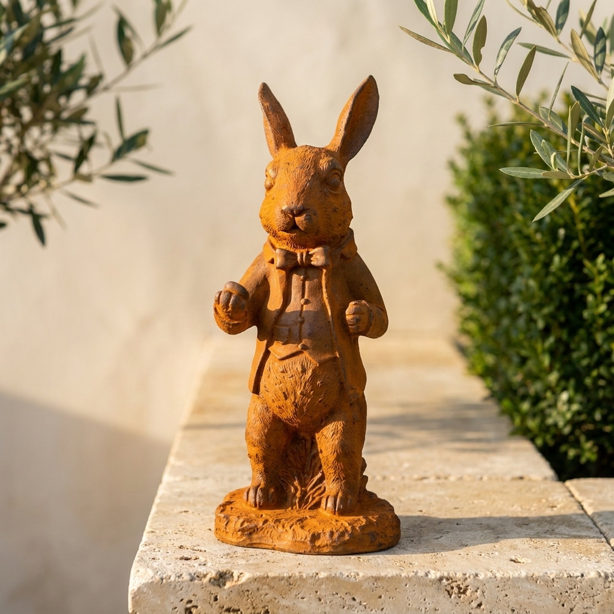 Doctor Bramble rabbit statue close view of the face, bow tie and raised paw
