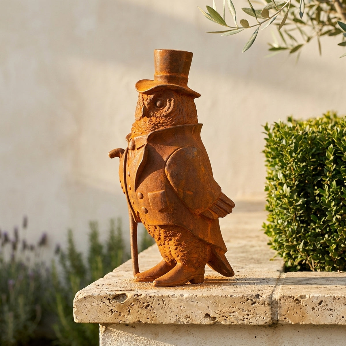 Professor Hoodwink owl statue side view showing the top hat, frock coat and cane