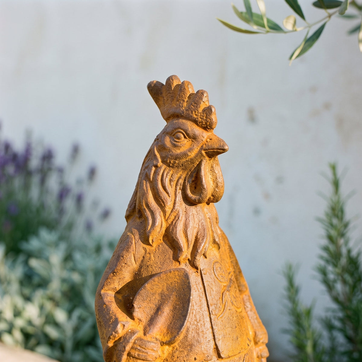 Mr Featherwick cast iron rooster statue, close view of the serrated comb, wattle and feathered ruff in natural rust patina