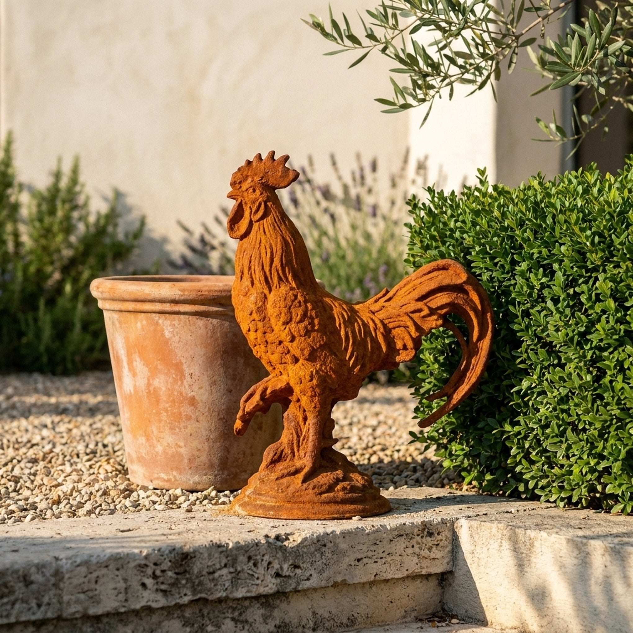 Chancellor Percival rooster statue three quarter view in a provencal courtyard