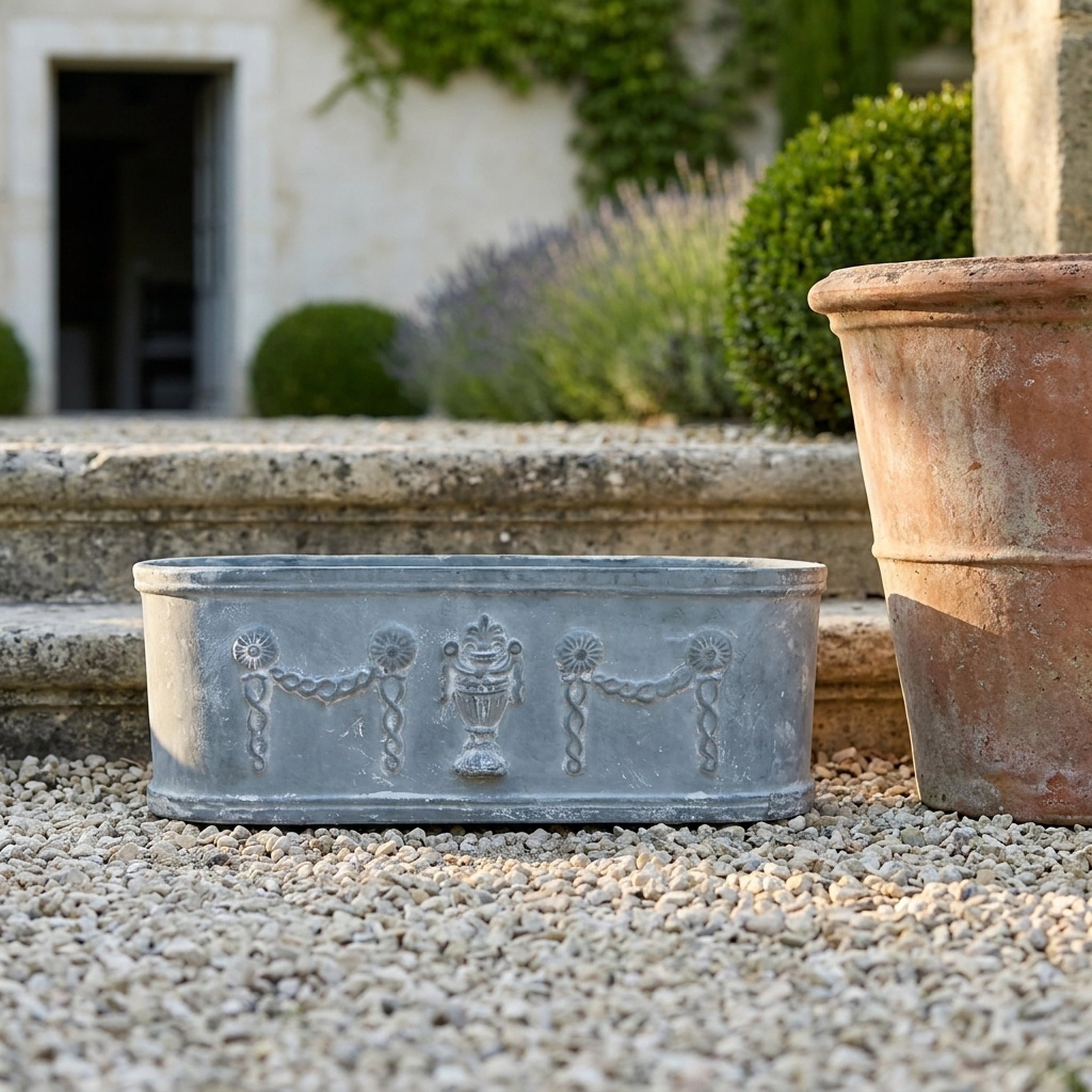 The Heritage Planter Grey cast iron trough planter front view showing the full height and finish