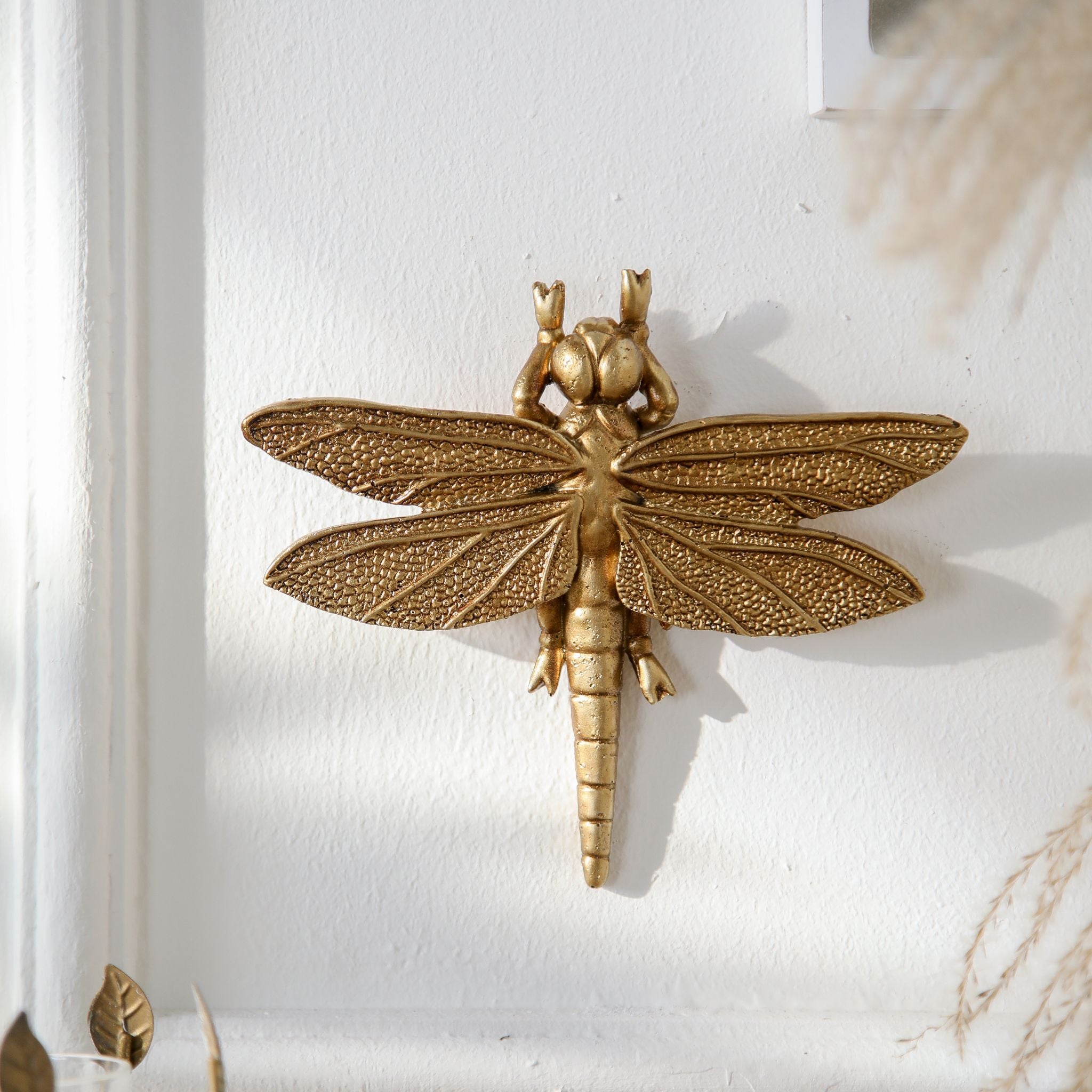 Lidia gold dragonfly wall decor straight on showing the textured veined wings