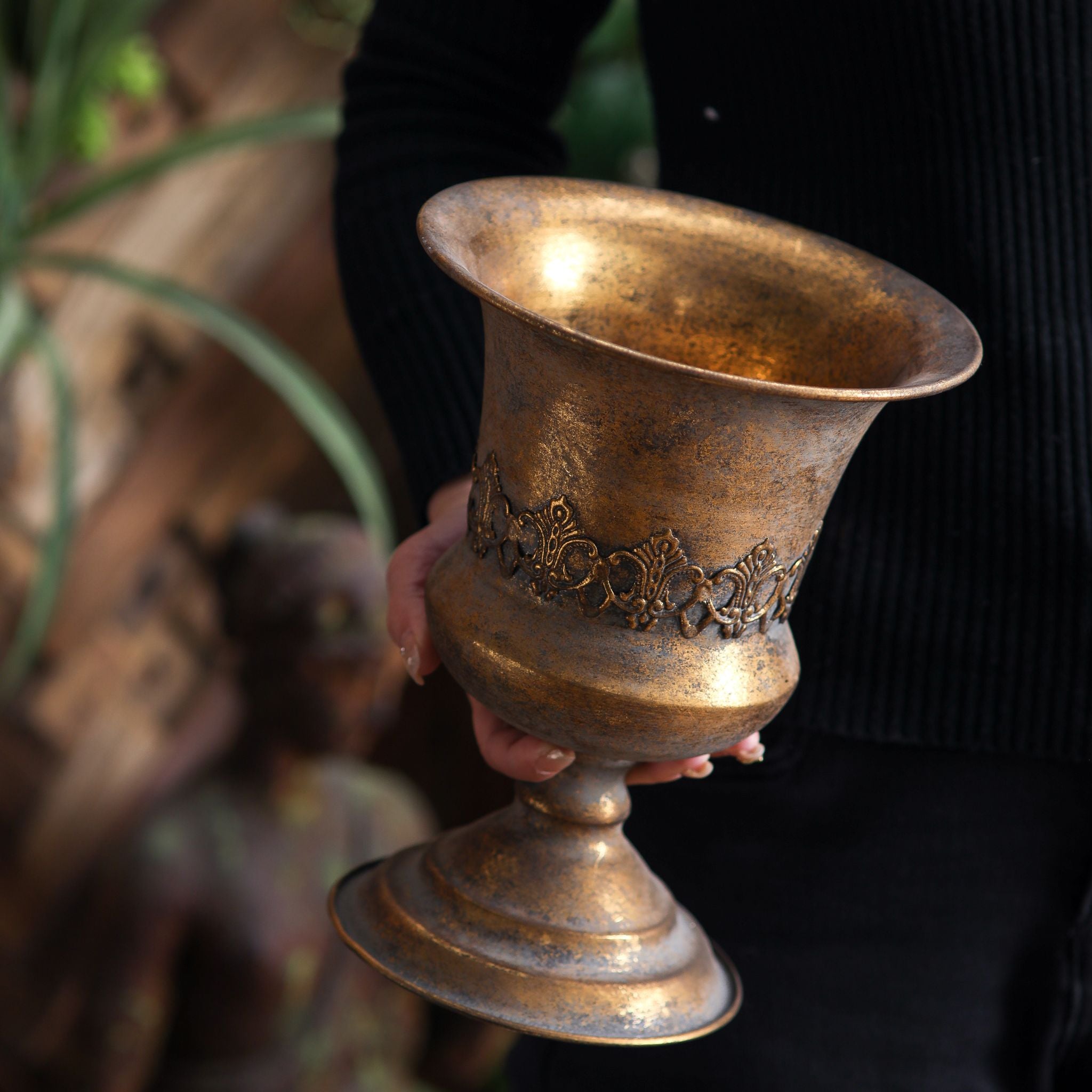 Magda pedestal urn held in hand showing the 26cm scale