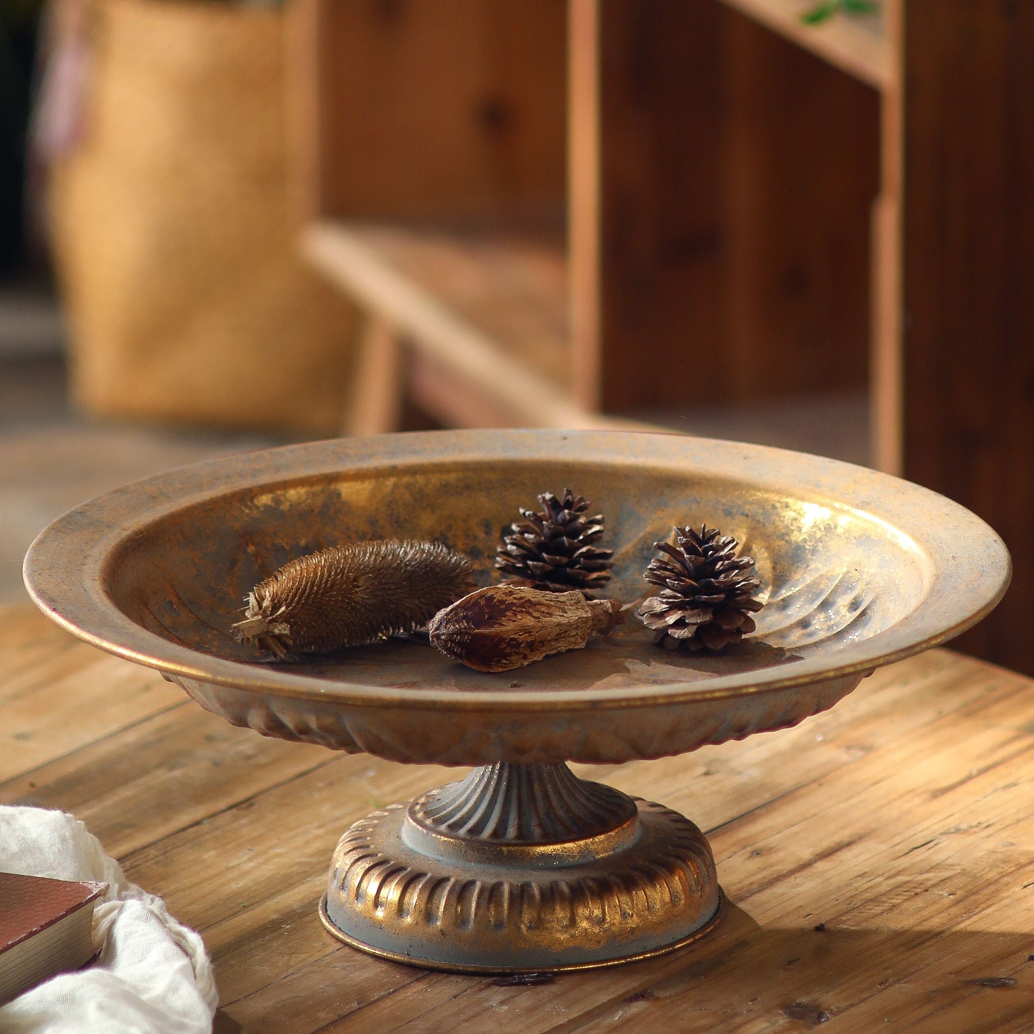 Menton burnished gold footed bowl straight on showing the fluted bowl and ribbed pedestal foot