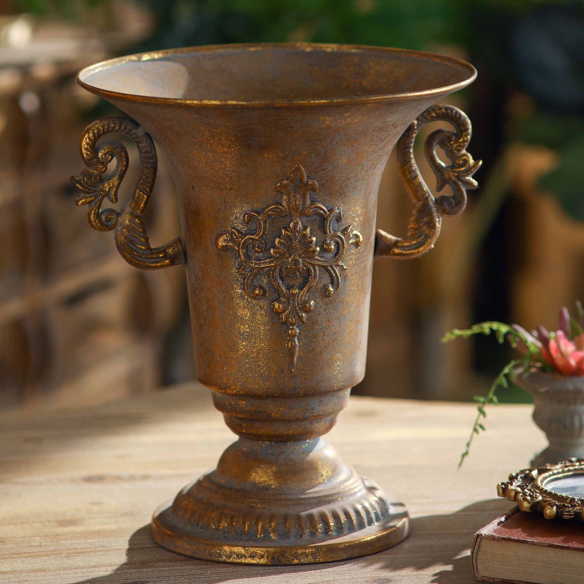 Capri urn vase full studio view showing the trumpet rim, scroll handles, and fleur crest