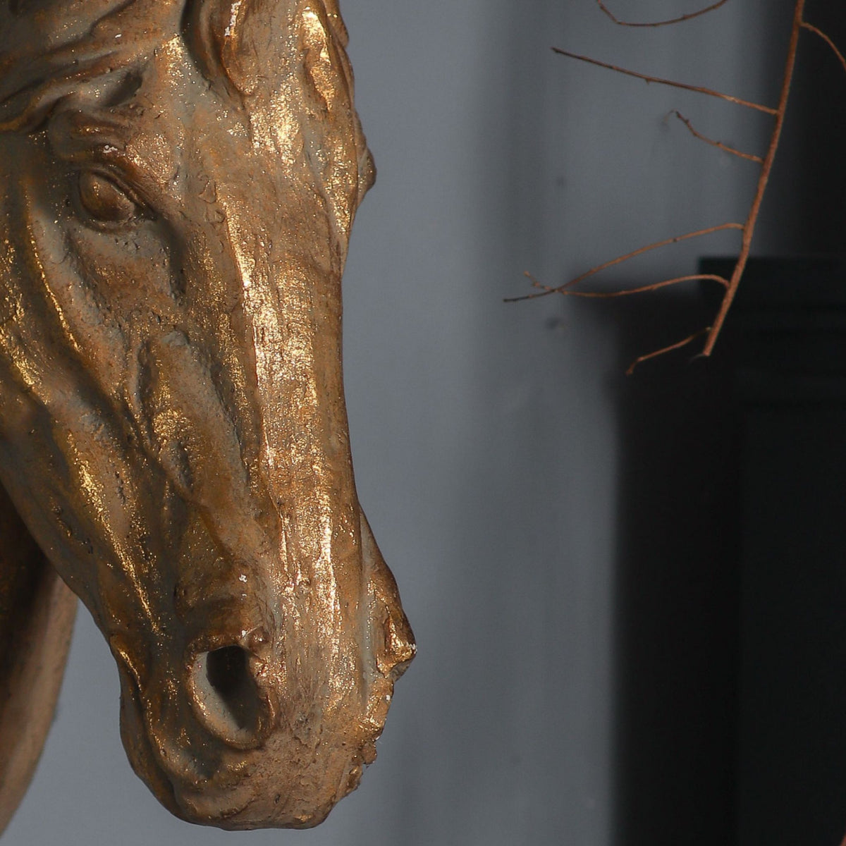 Cara horse head close-up of the gilded muzzle and hand-brushed aged gold finish