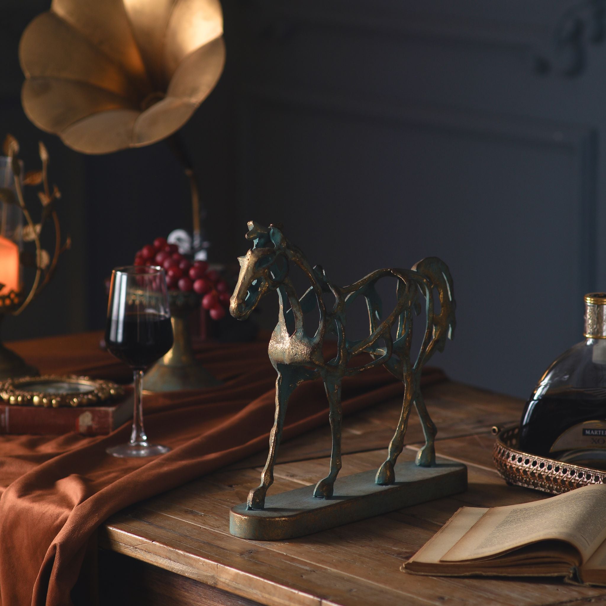 Jules abstract horse sculpture, openwork metal in antiqued gold and verdigris on an oval base
