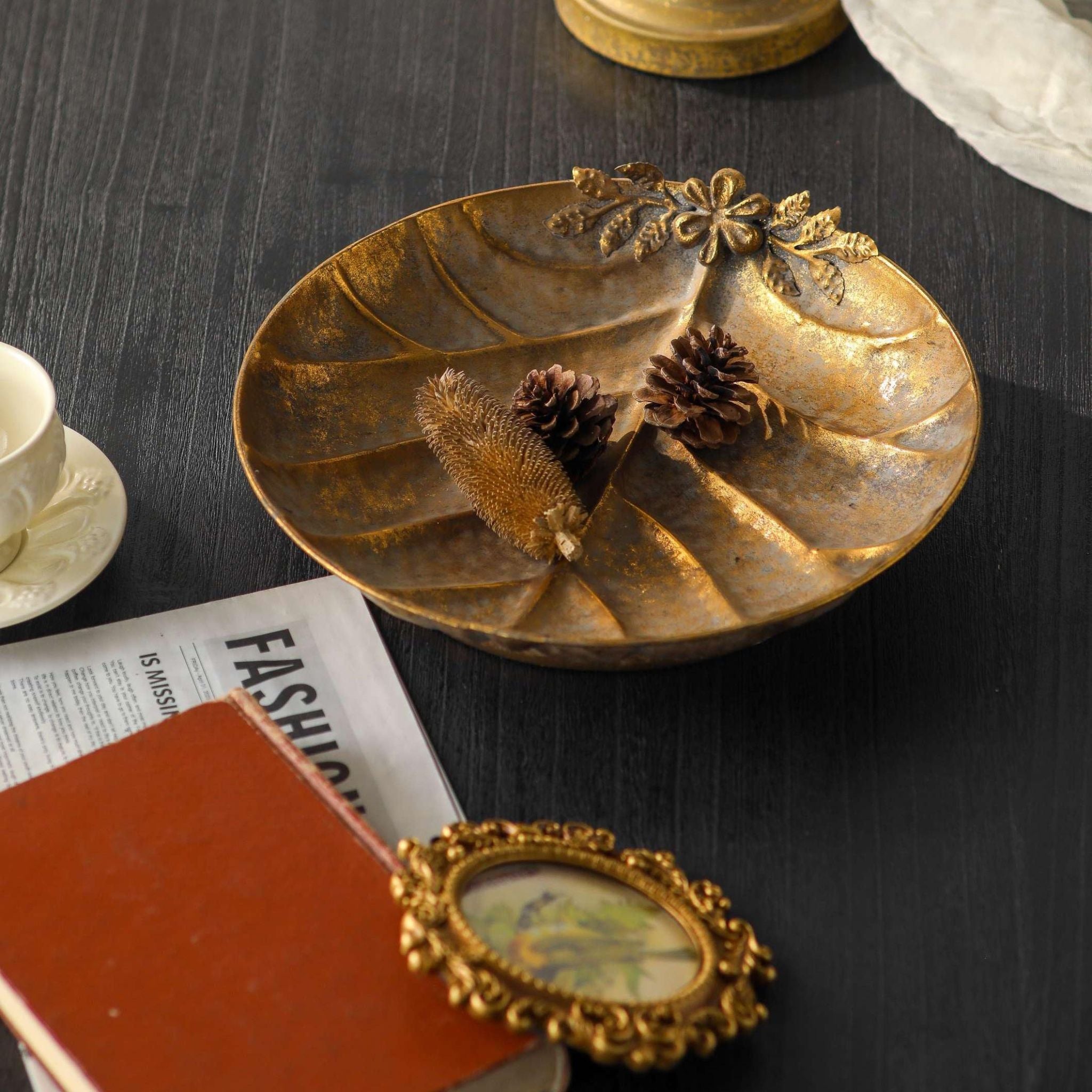 Close detail of the Alida leaf dish raised flower and leaf sprig and the pressed vein pattern