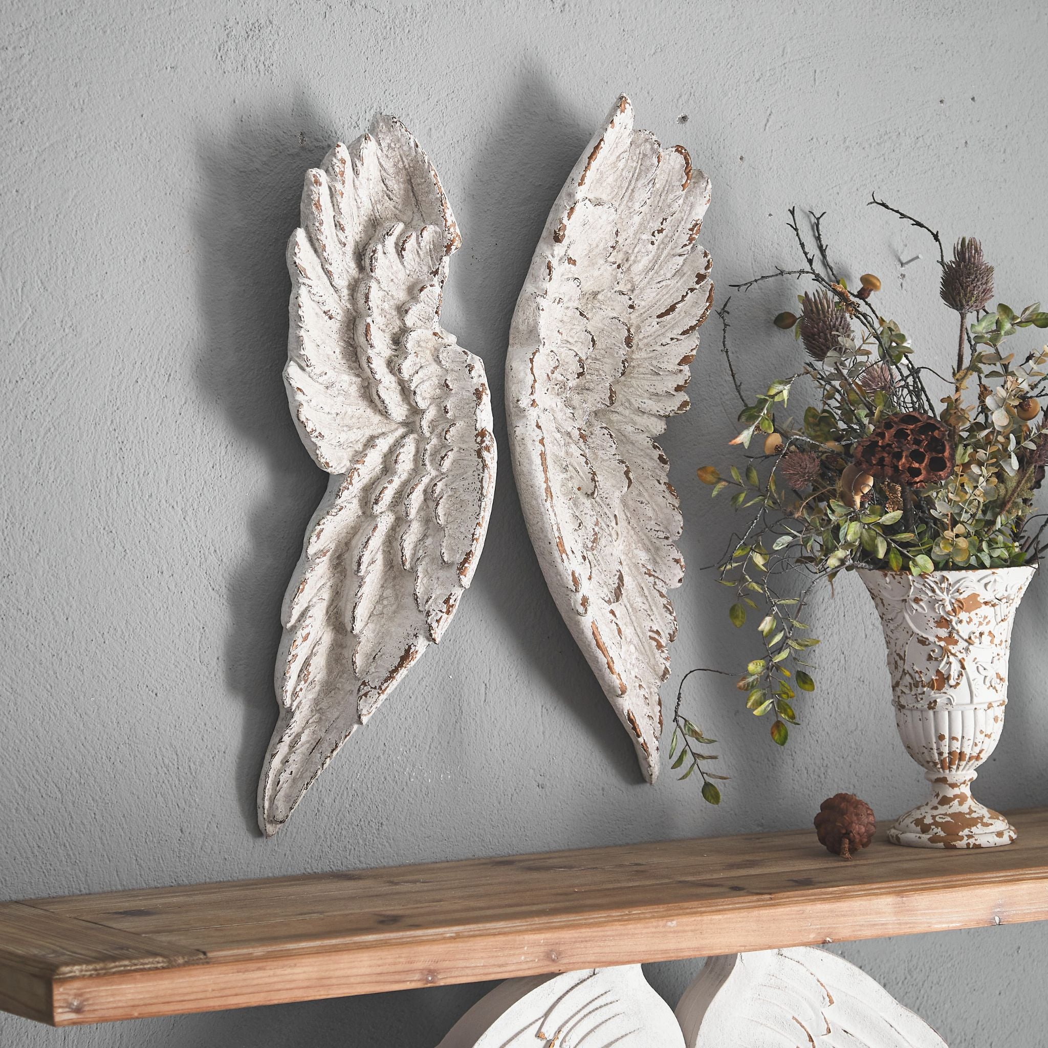 Alora French Provincial angel wings wall art, a pair of moulded wings in distressed white worn to a warm clay tone.