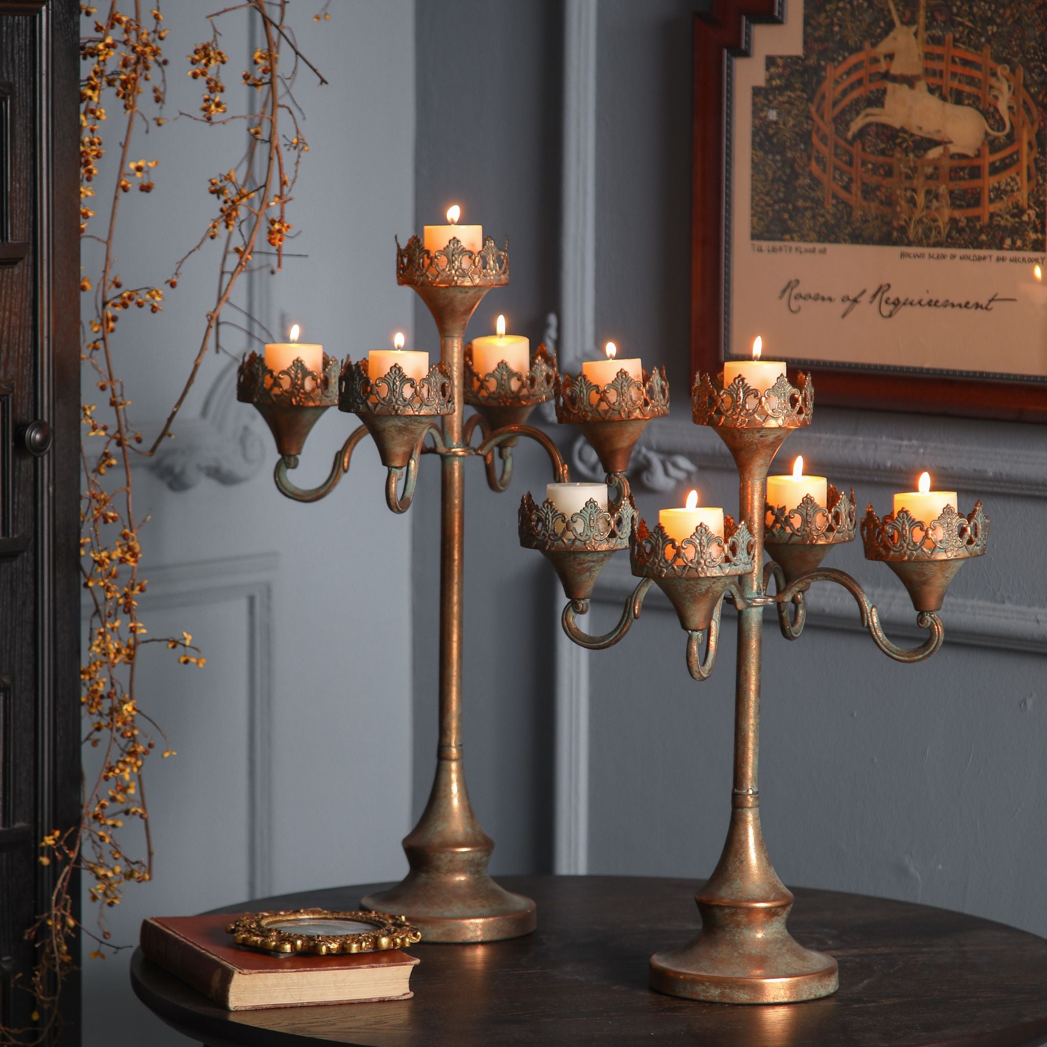 Emma shown taller at back beside the shorter Corrine candelabra, both lit. Sold separately.