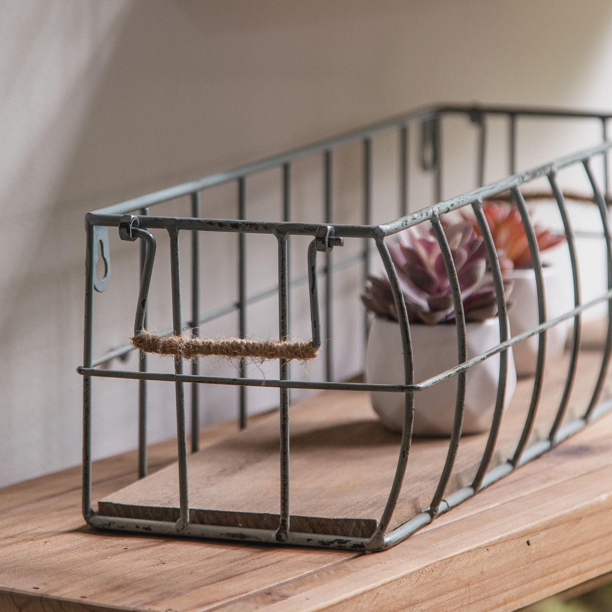 Aurelie wire basket close-up of the keyhole wall hanger, jute-wrapped handle and timber base