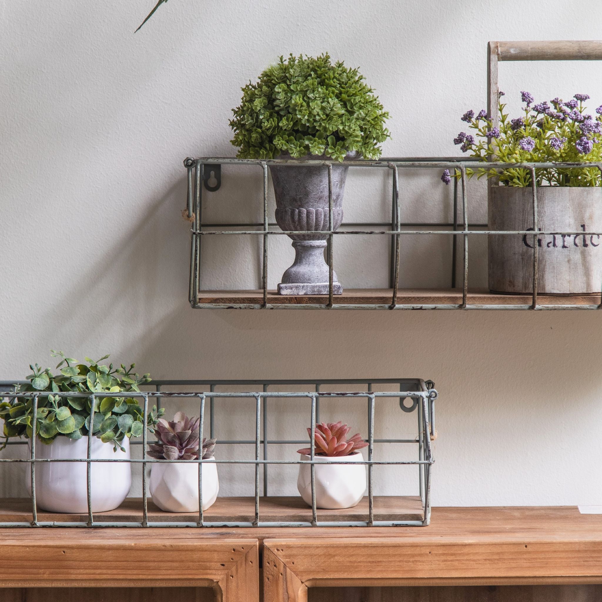 Aurelie wire baskets, both sizes, filled with potted greenery and succulents