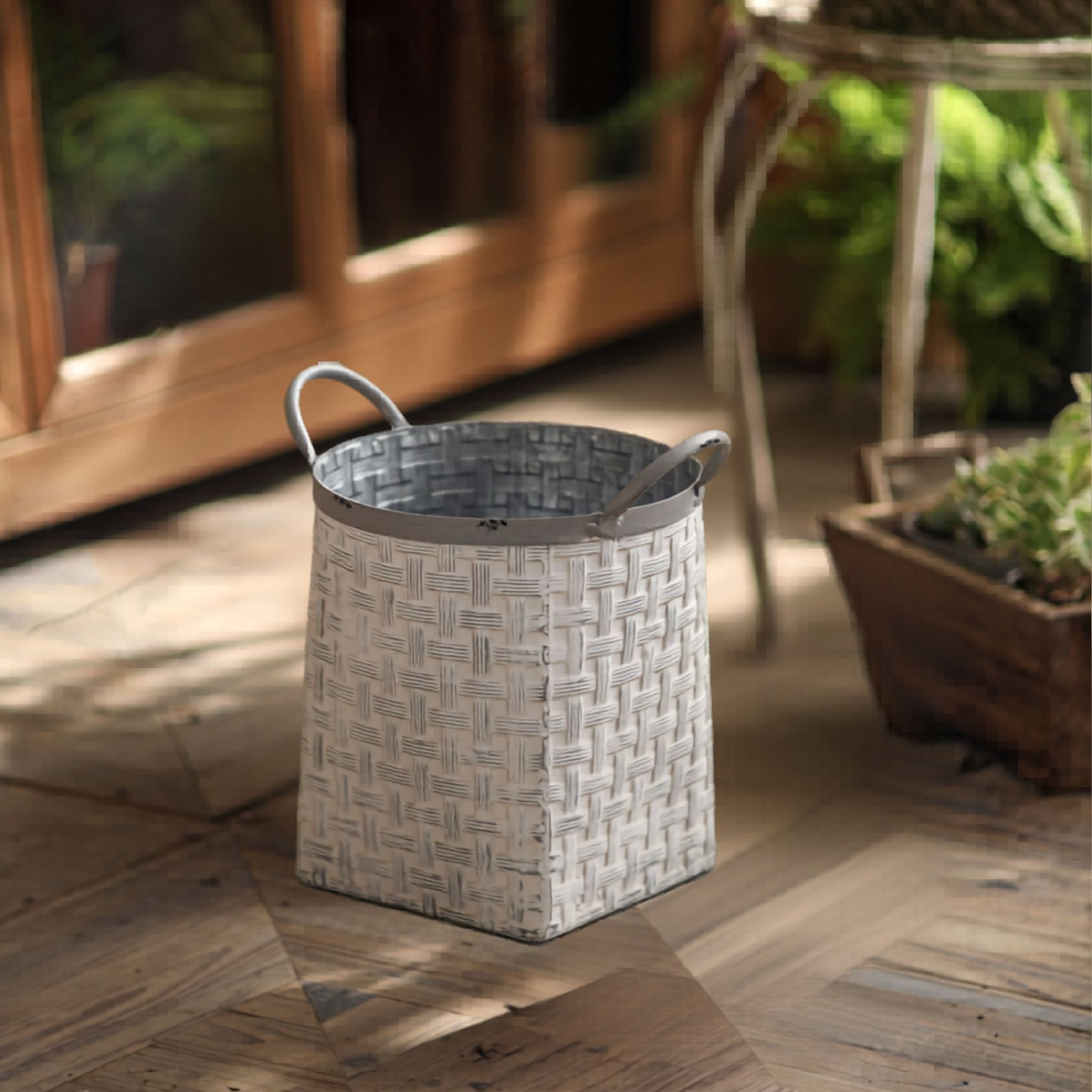 The smaller Daphne basketweave planter empty, showing the woven texture and handles