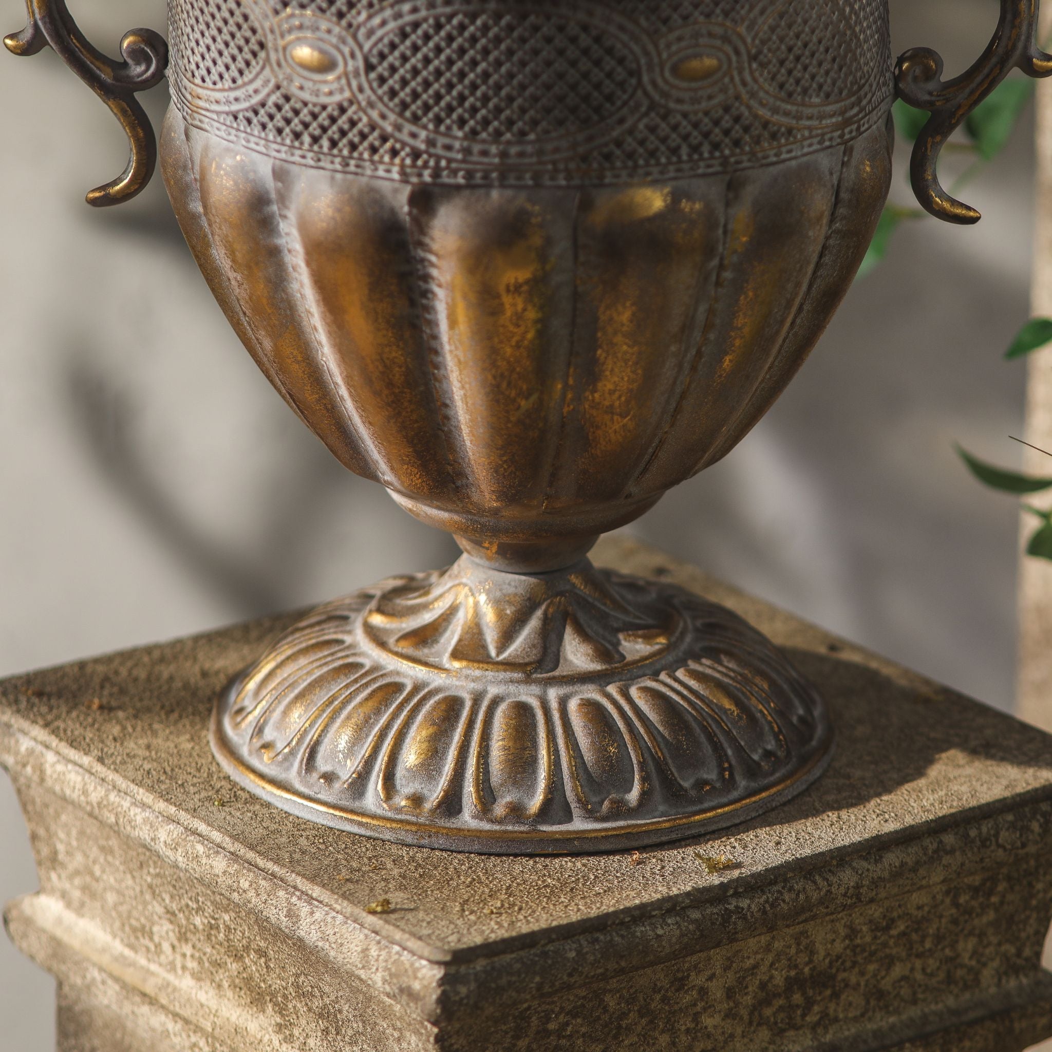 Close-up of the Benjamin urn gadrooned bowl and ornate gadrooned foot in aged antique gold.