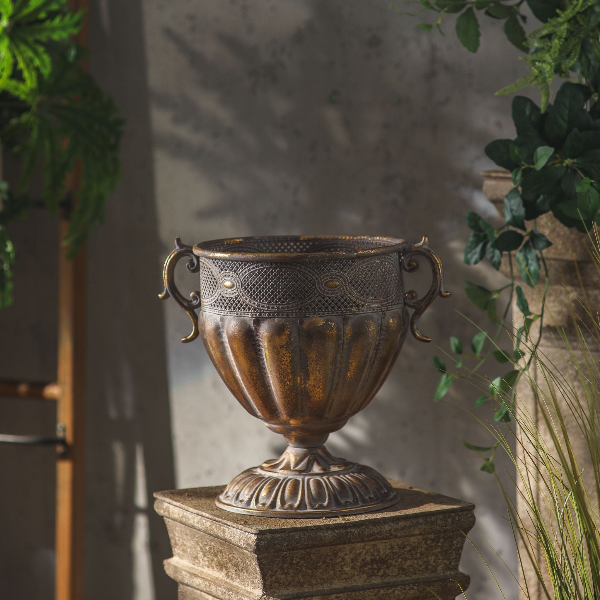 Benjamin urn planter shown empty, scroll handles, pierced openwork band, gadrooned bowl and foot in antique gold.