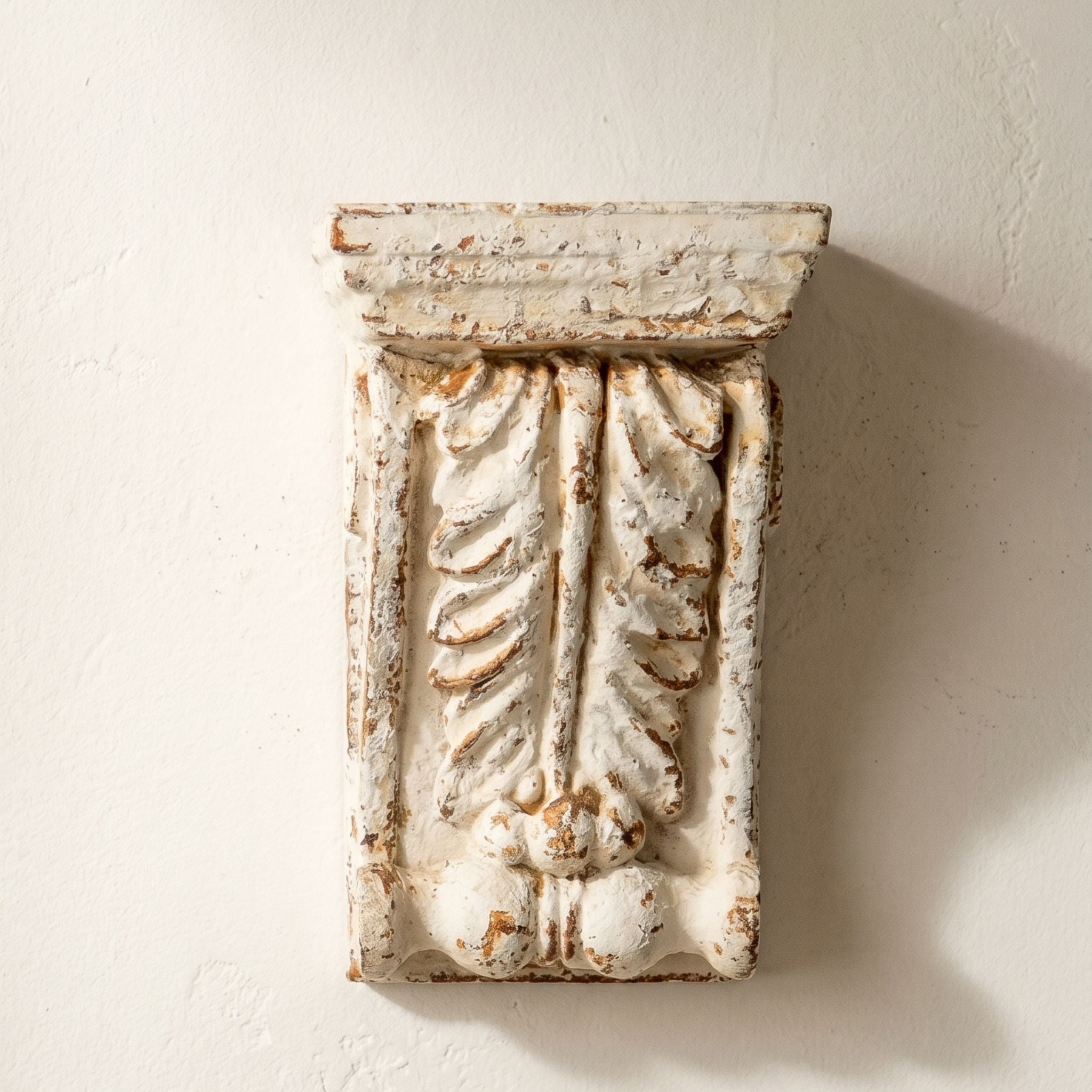 Brigitte acanthus corbel wall sconce in distressed white, front view. 