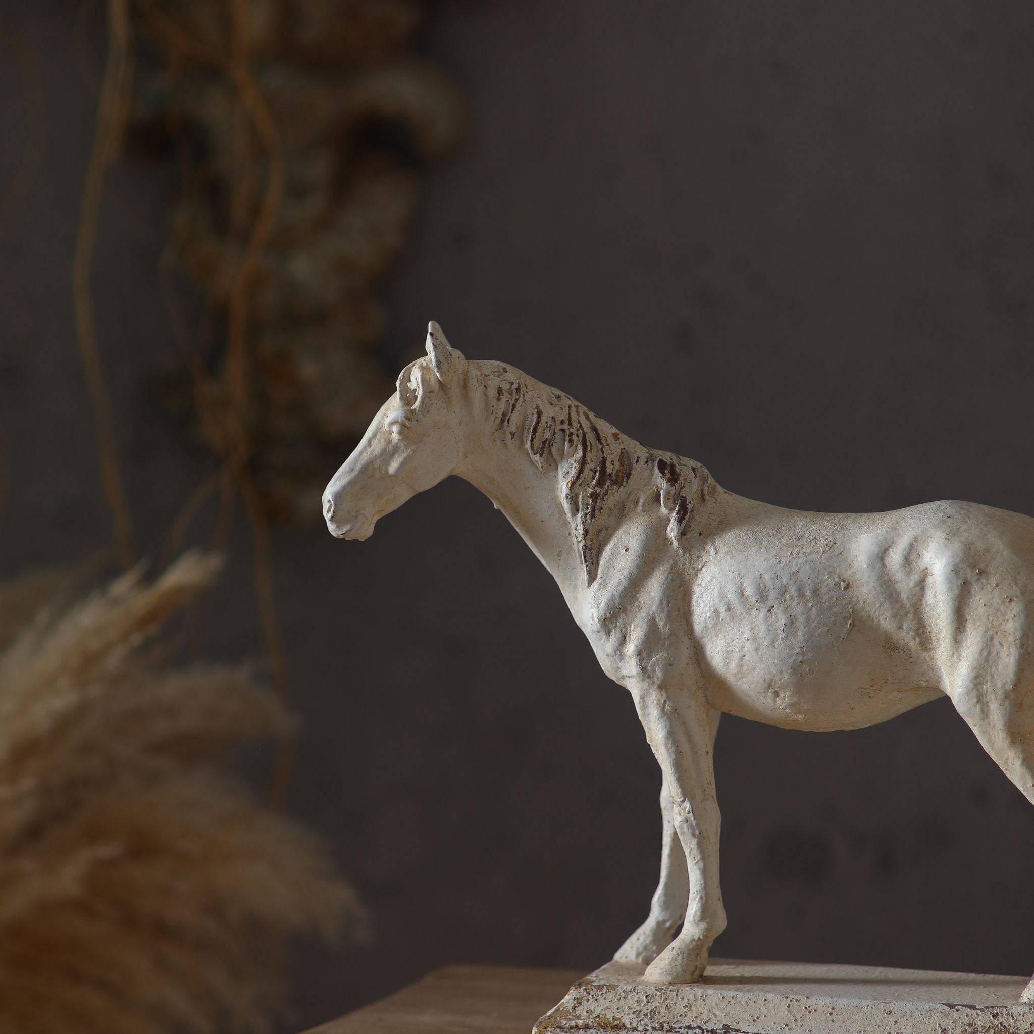 Three-quarter view of the Camargue horse sculpture showing the head, mane and body modelling.