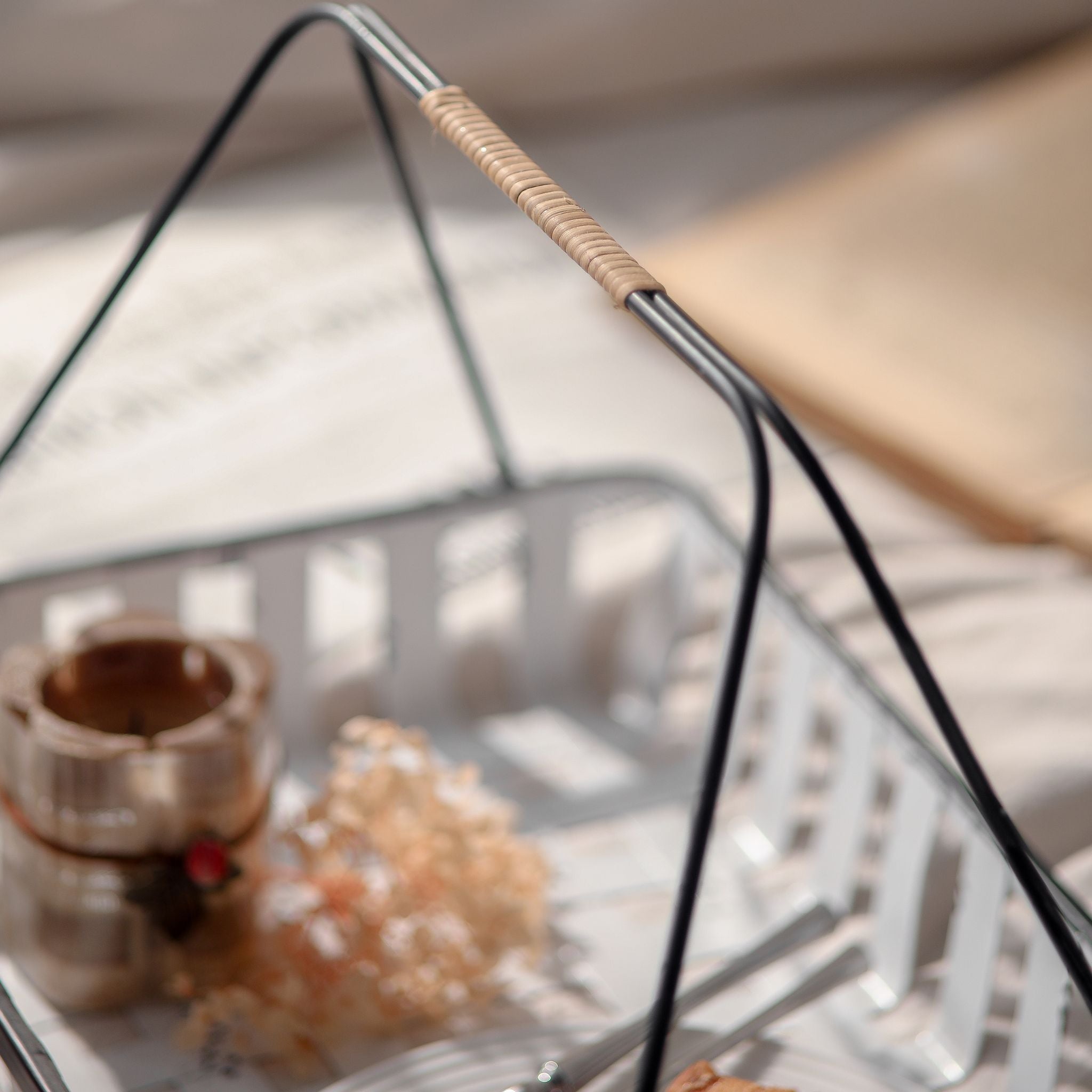 Close view of the rattan-wrapped grip on the Chantal basket handle