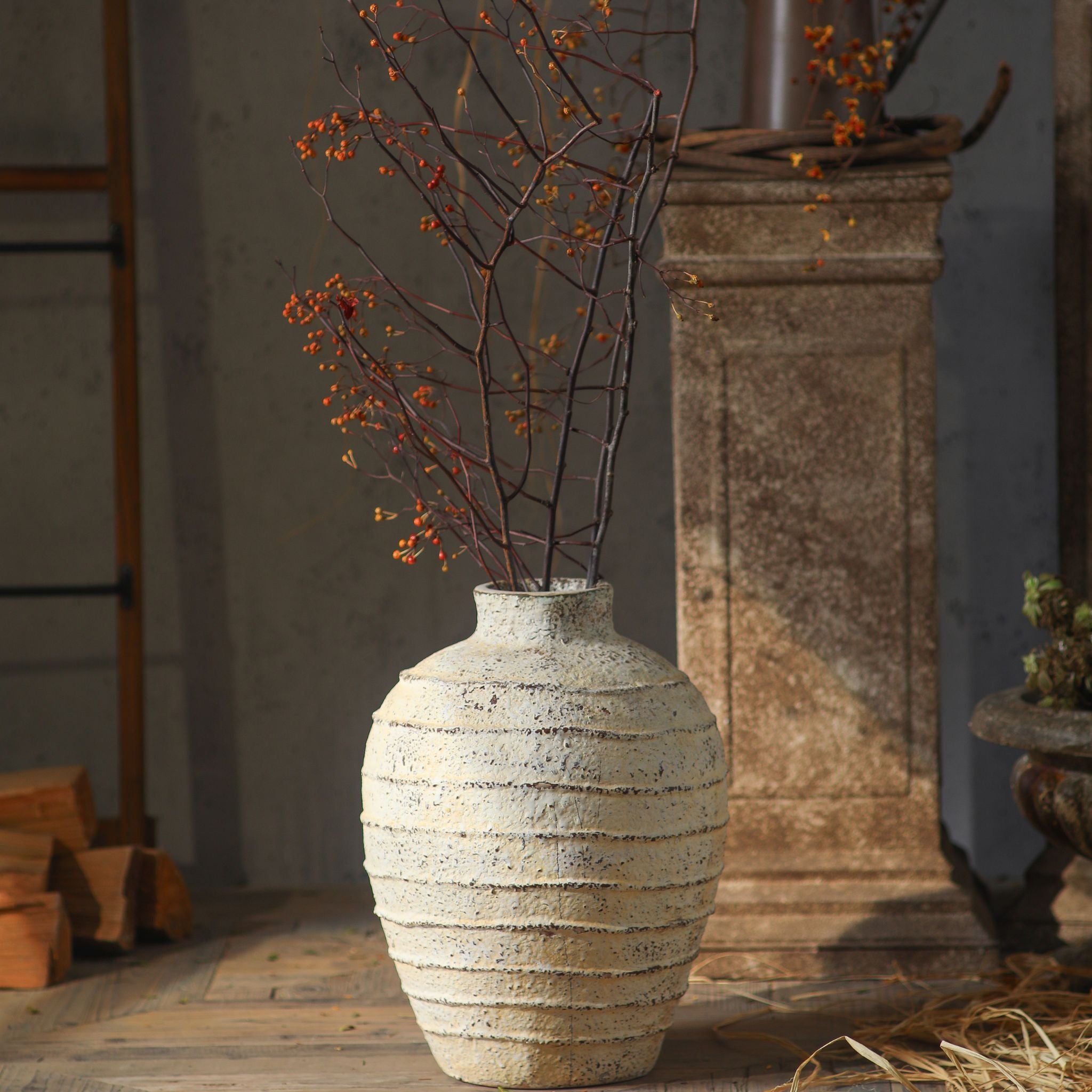 Charles ribbed vase with branches in a French provincial room scene