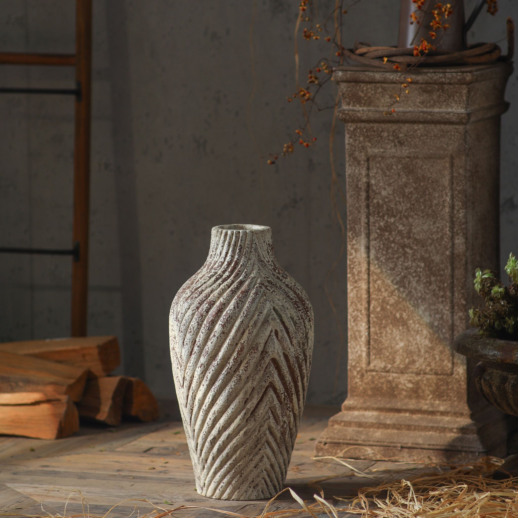 Clement tall chevron-ribbed vase in distressed cream and terracotta, empty, side light. Hero