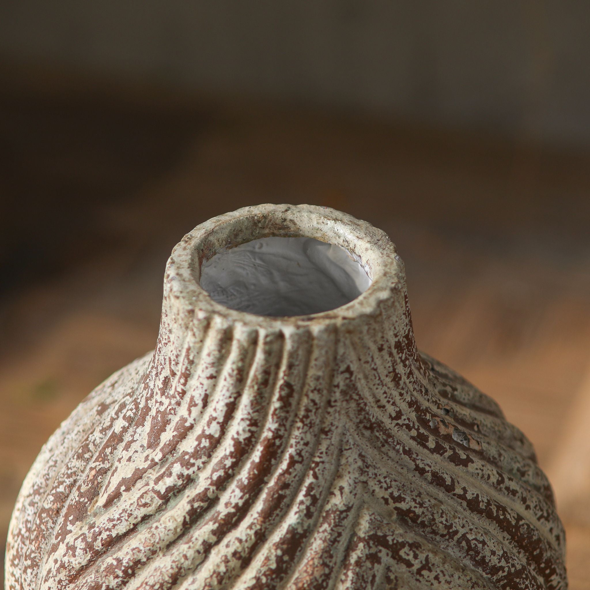 Clement chevron vase close-up of the ribbed neck, opening and worn cream finish