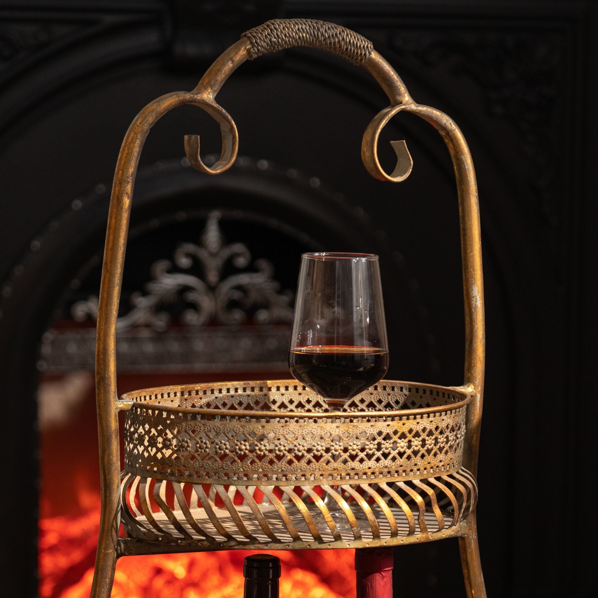 Close view of the pierced floral gallery rail and wrapped grip on the antique gold stand