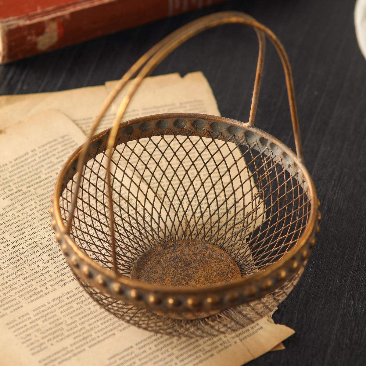 Diane wire basket from above, empty, showing the fine diamond mesh weave and base.