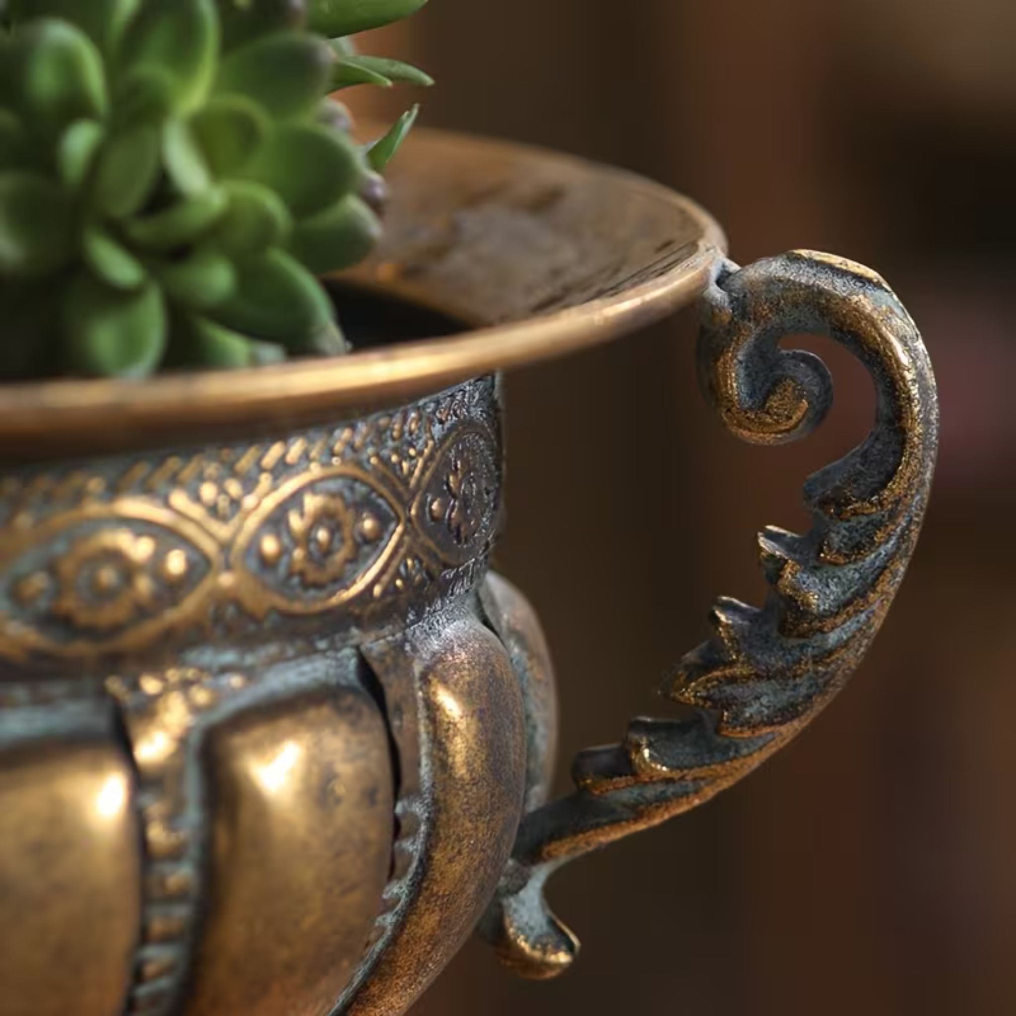 planter-handle-detail.jpgDominique footed urn planter close-up of the scrolled handle and embossed band