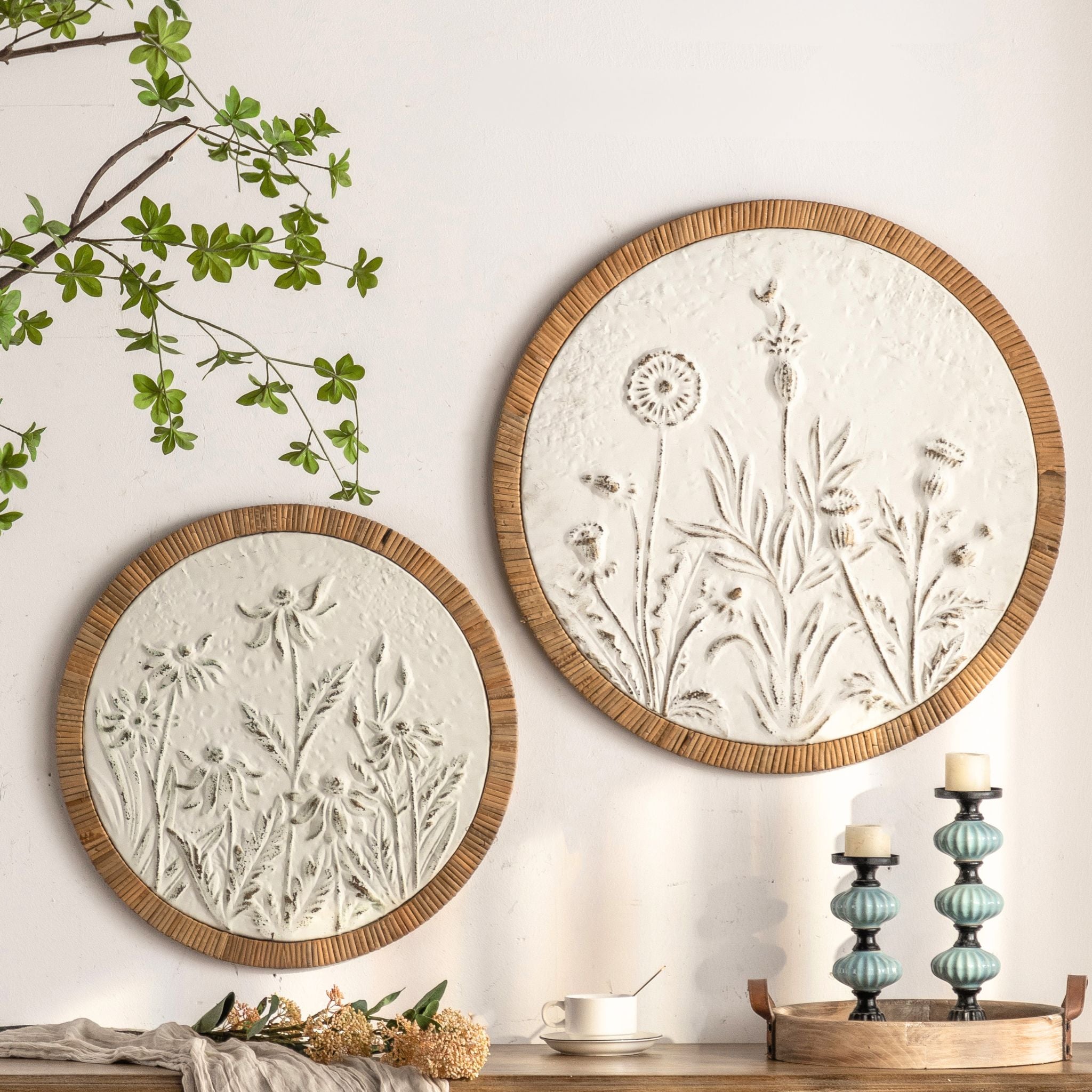 The Dumas round wall art styled on a wall beside its smaller companion in a French country room.