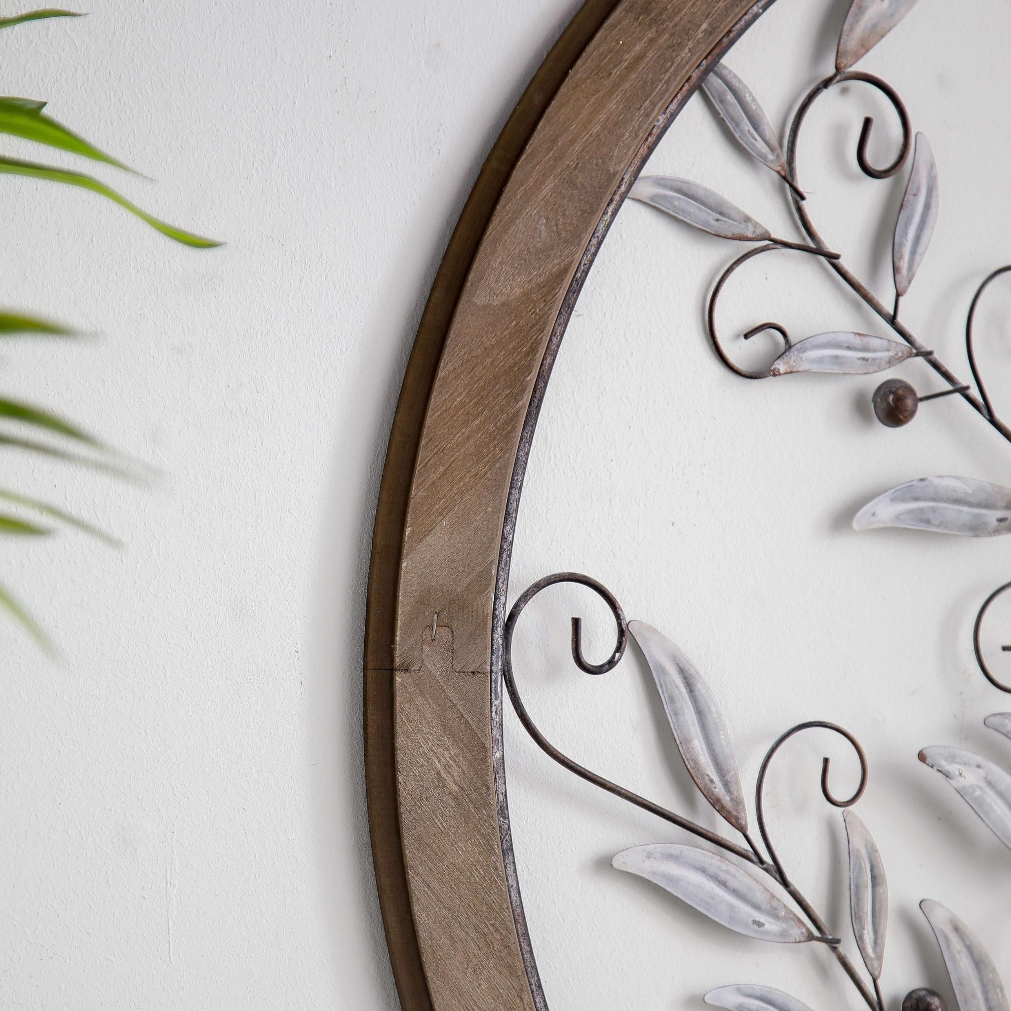 Detail of the fir timber frame and the keyhole fixing on the round tree of life wall art