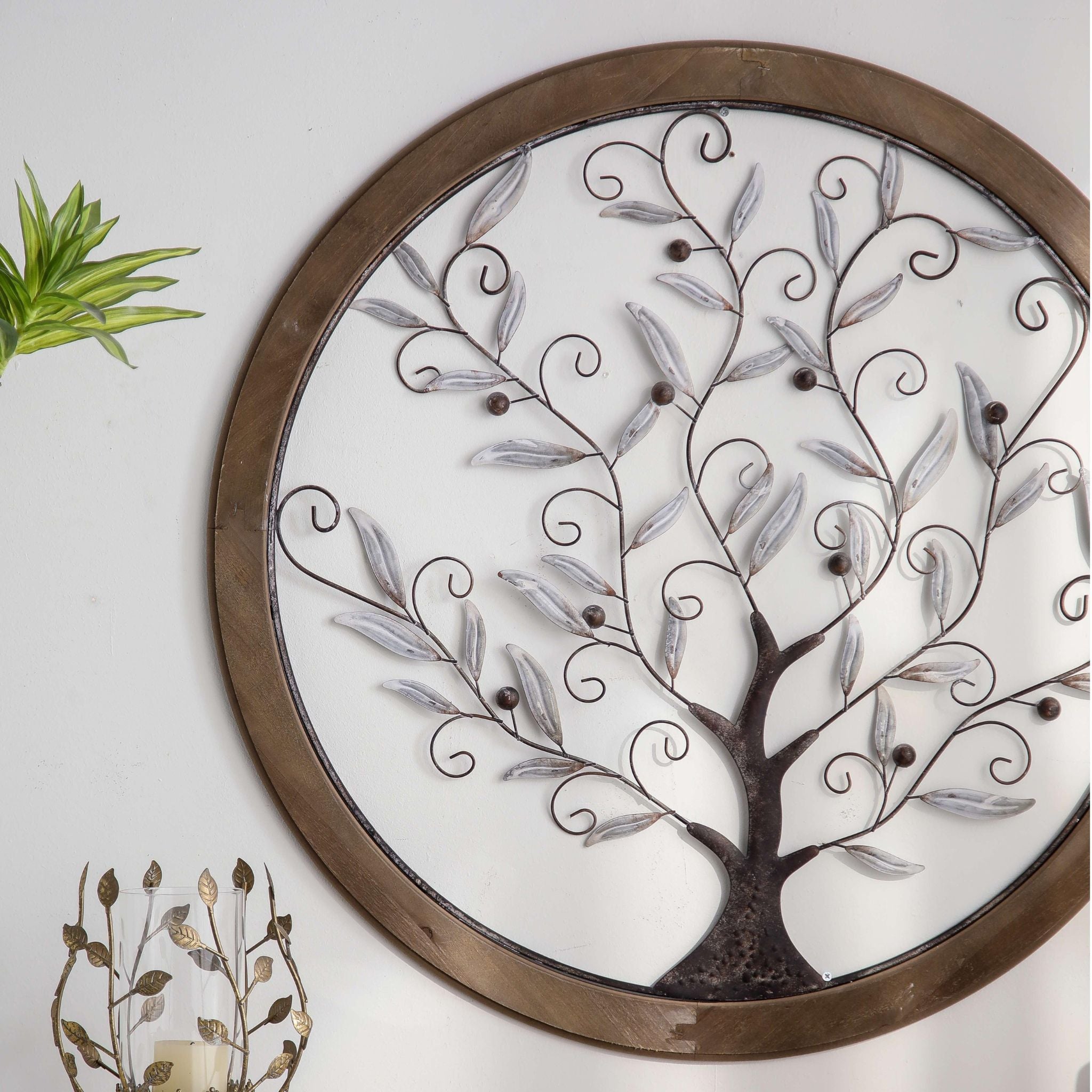 Angled view of the tree of life wall art showing the raised metalwork against the open frame