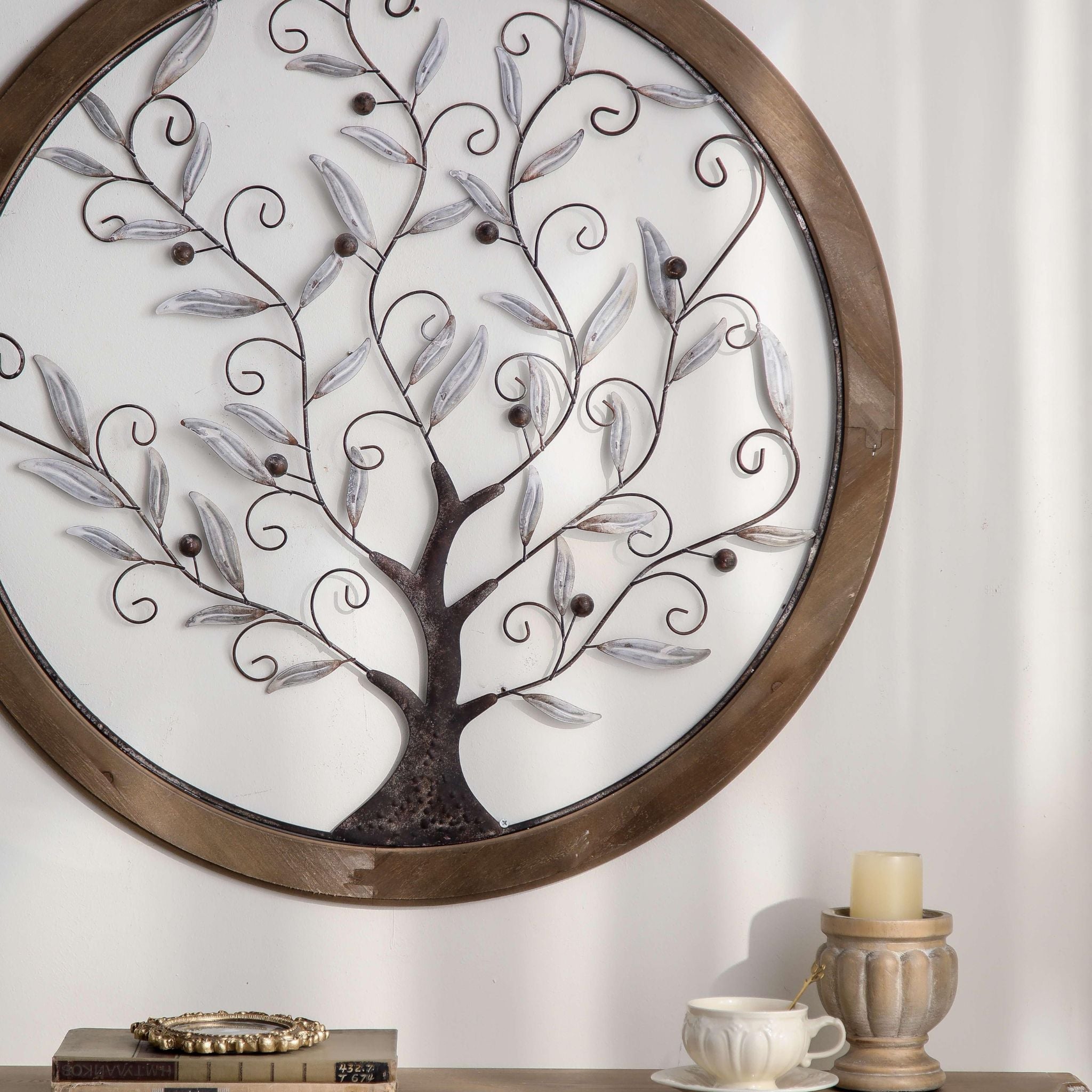 view of the round tree of life wall art above a styled console
