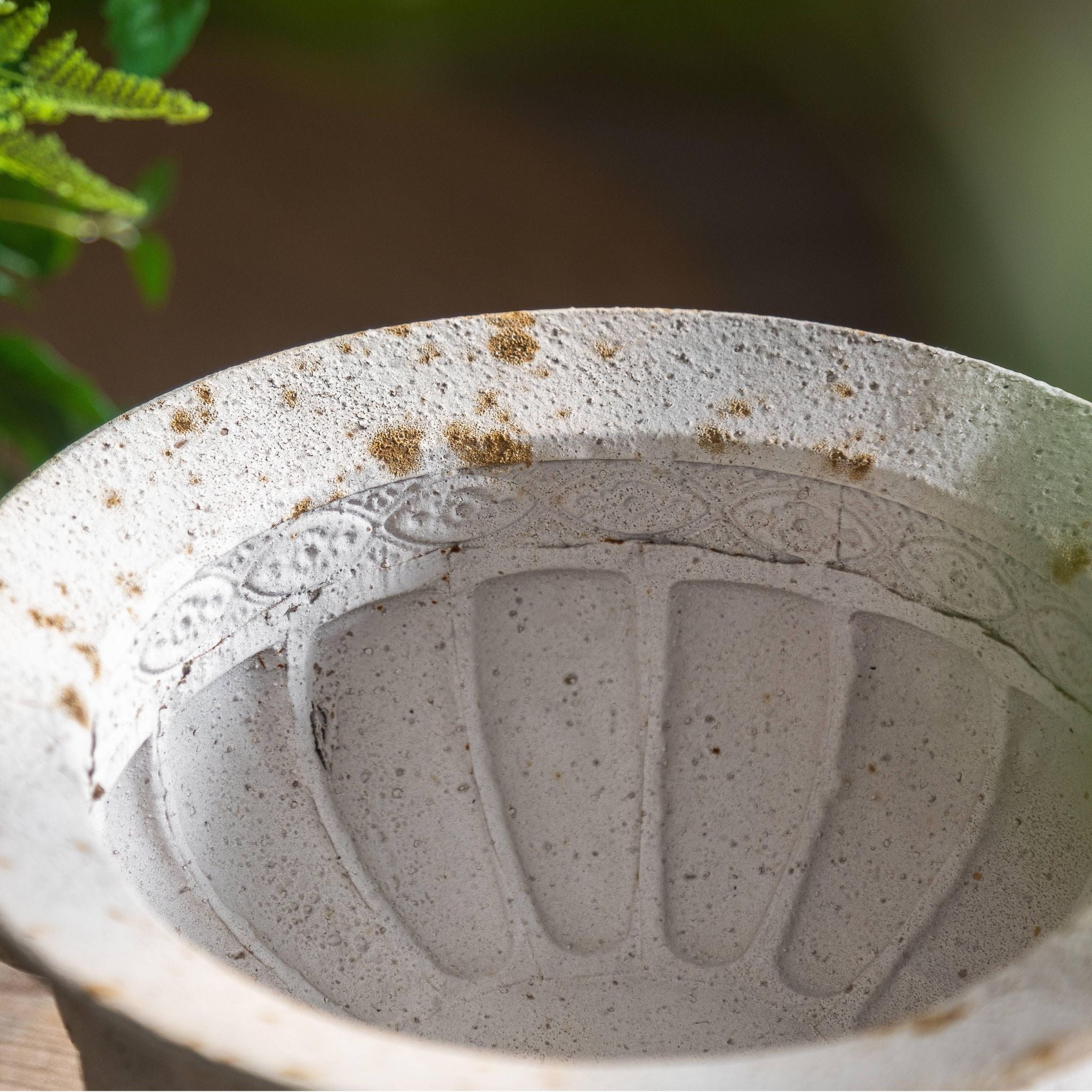 Top-down view into the Fabien urn showing the embossed band and ribbed interior.