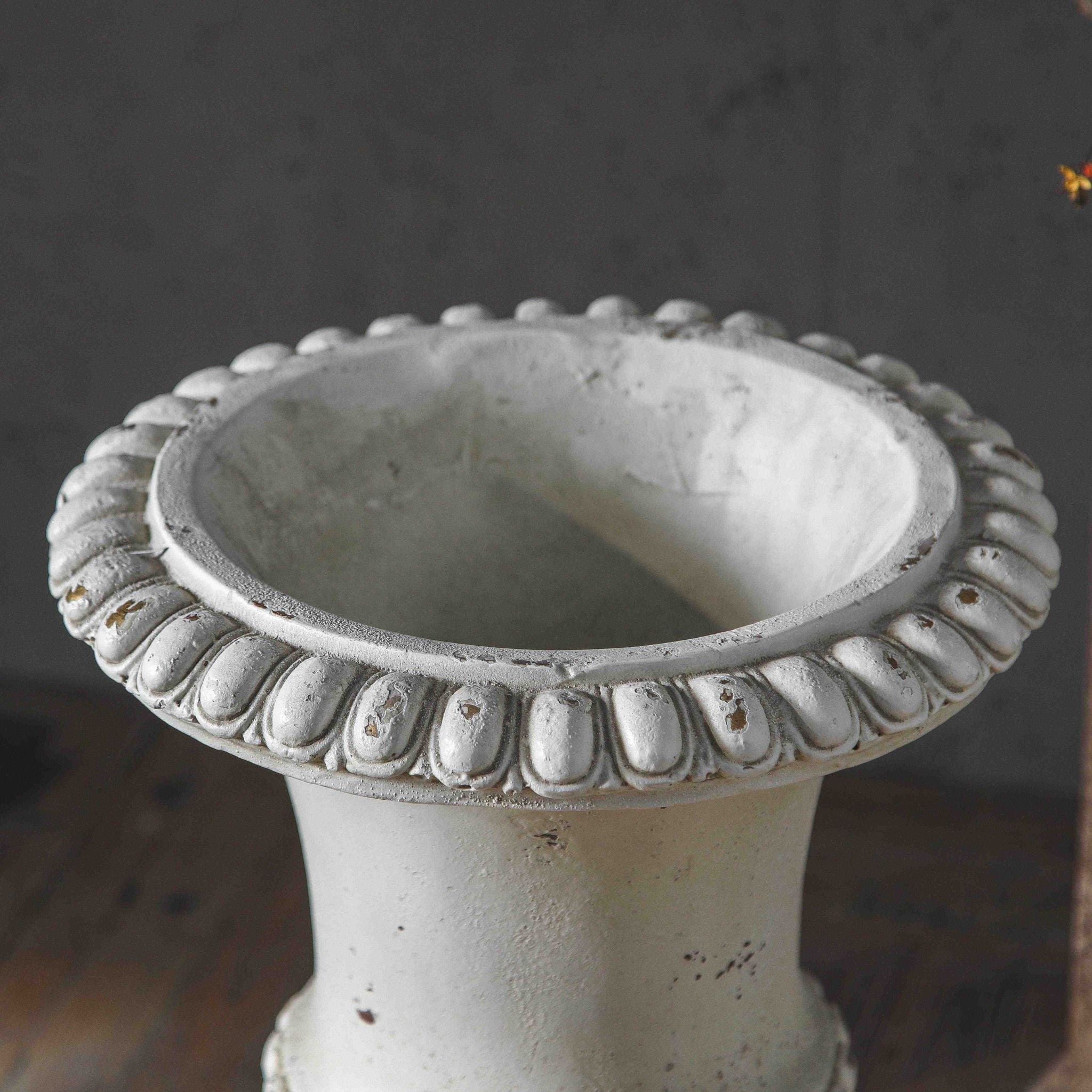 Top-down view of the Florentine urn rim showing the gadrooned egg-and-tongue moulding and the bowl interior.