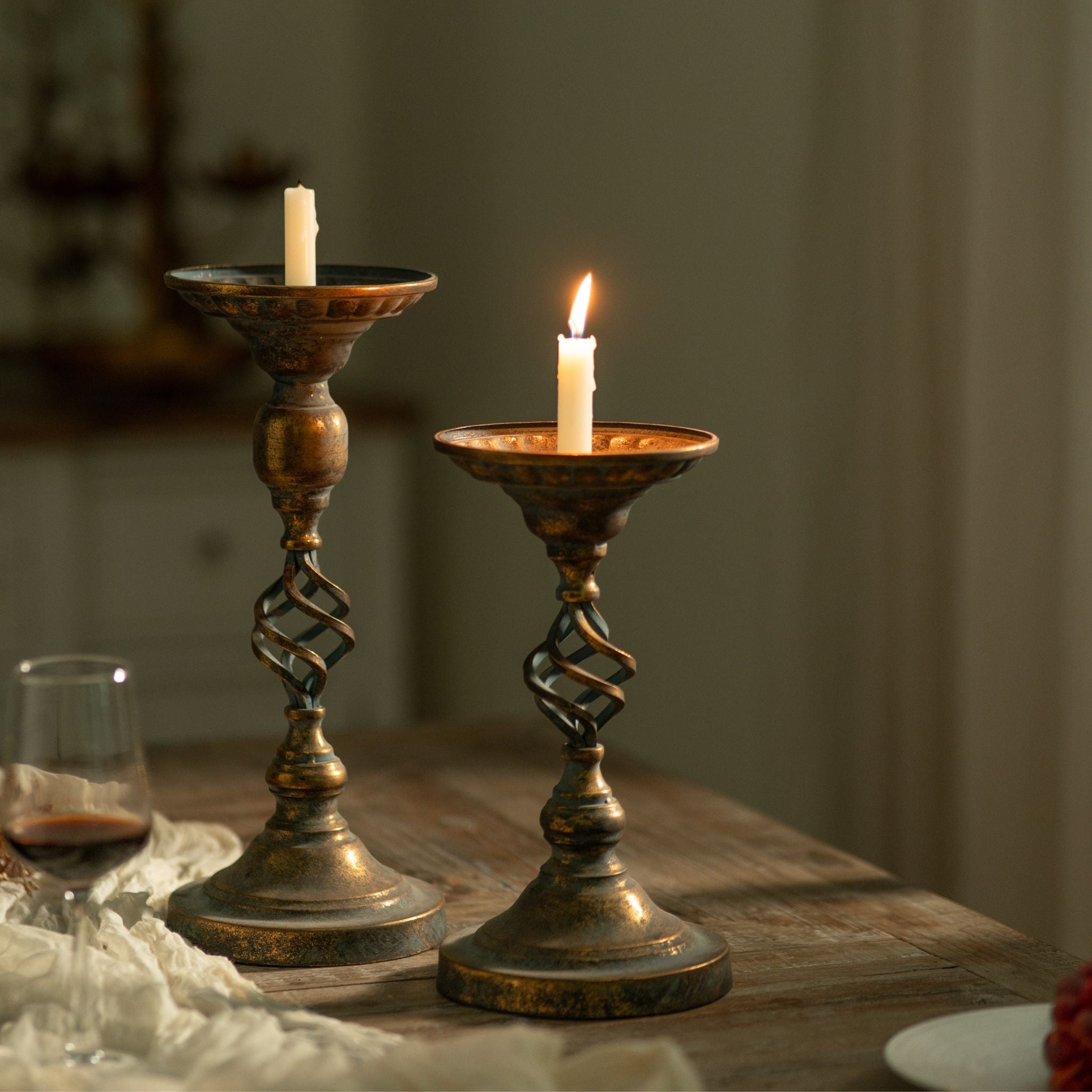 Francis and the taller Michel candle holders together showing the two heights, both in antique gold and verdigris.