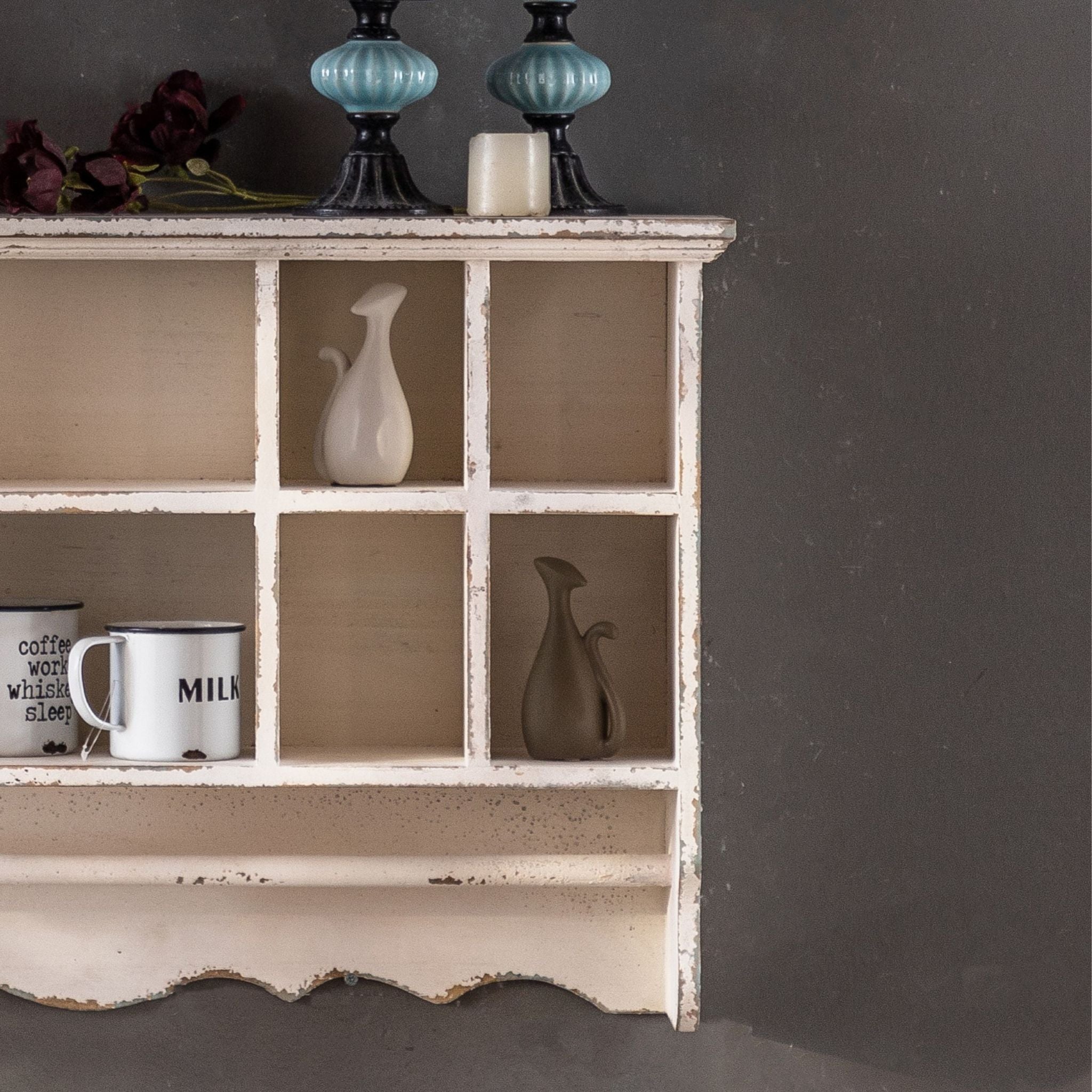 Guy wall shelf, close detail of the open cubby compartments and the scalloped lower shelf.