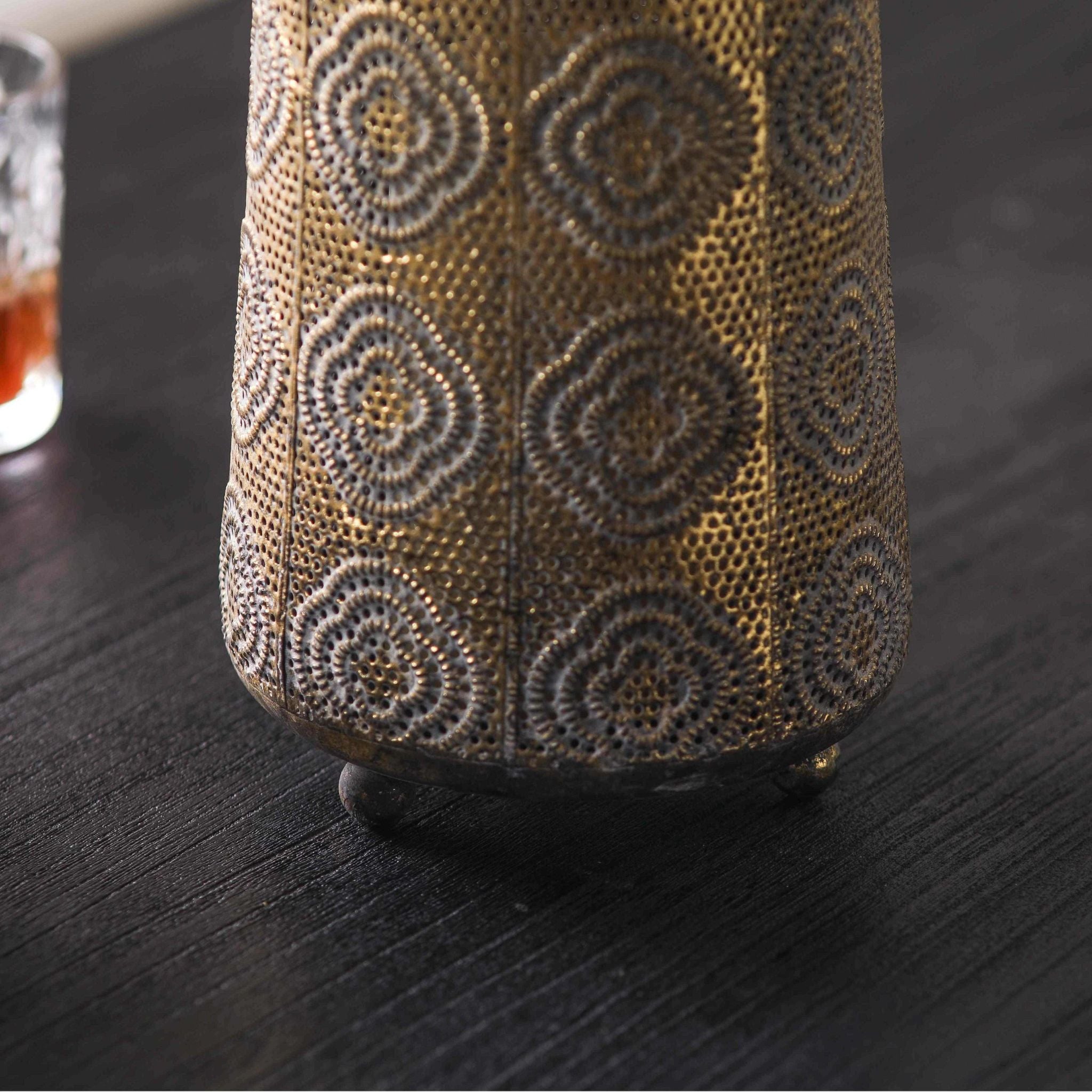 Jasmine lantern close-up of the pierced dotted floral pattern and footed base
