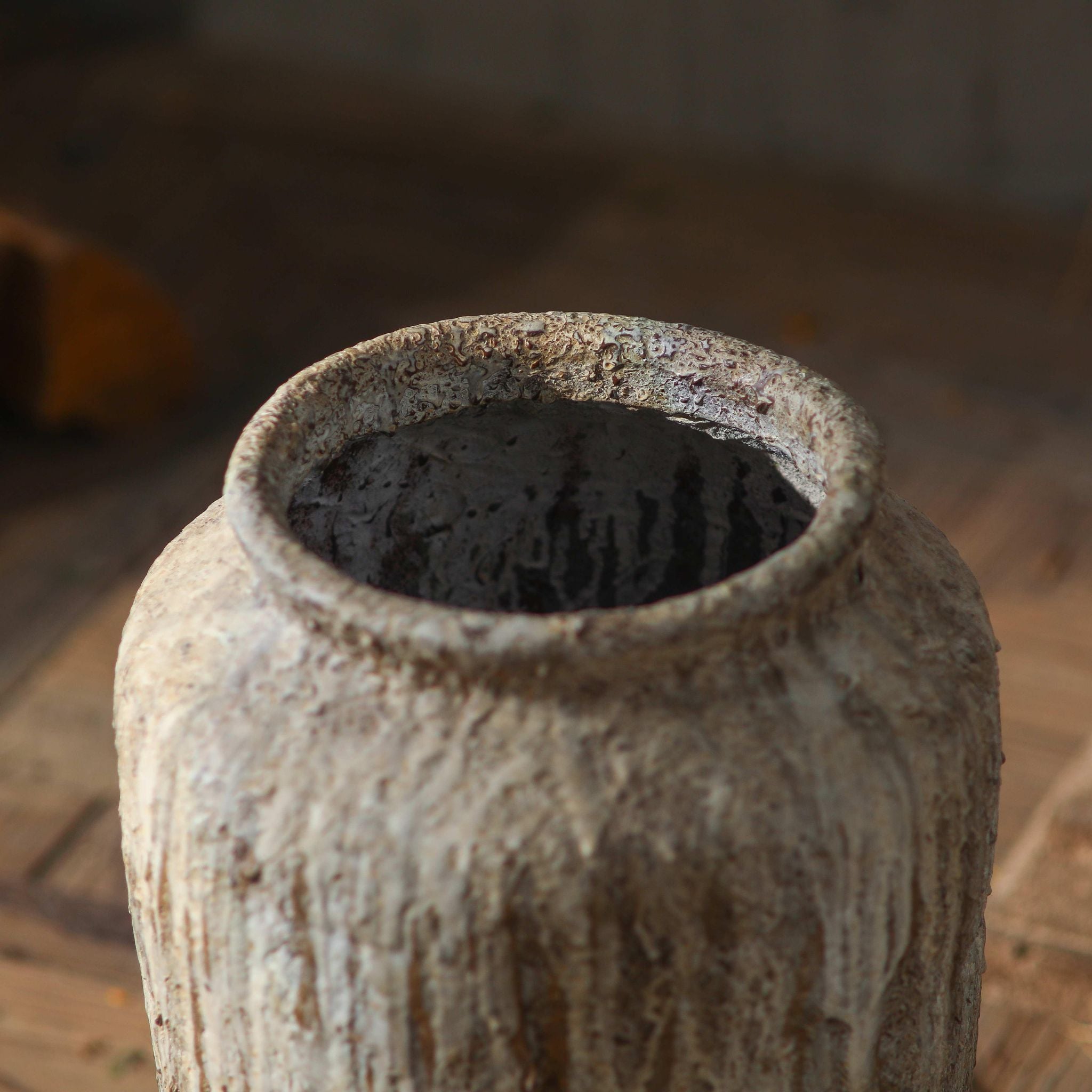 Jean-Marc close-up of the rolled rim and the rough weathered surface of the jar.